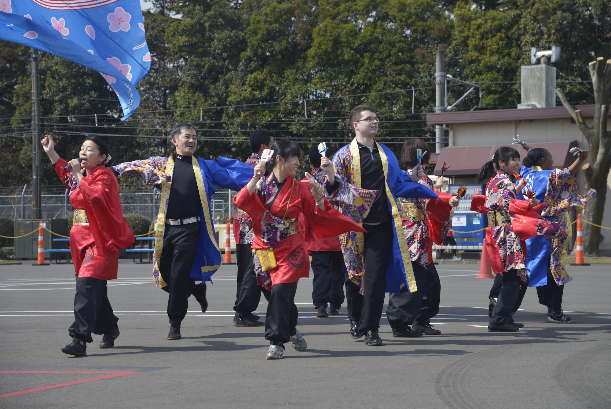 Members of the Yosakoi Dance Performance group showcase their moves during the Yokota Safety and Readiness Festival at Yokota Air Base, Japan, March 10, 2017. Other demonstrations consisted of an earthquake simulator, smoke house, seatbelt demonstrations, fire fighter demonstrations, Tokyo Metro Police motorcycle demo and a traffic safety demonstration team performed. (U.S. Air Force photo by Staff Sgt. David Owsianka)