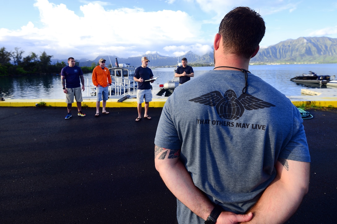 New York Air National Guard Maj. Glen Weir gives a safety and mission brief before conducting training with Human Space Flight Support Detachment 3 at Marine Corps Base Hawaii, March 5 2017. Weir is a combat rescue officer assigned to the New York Air National Guard's 103rd Rescue Squadron, supported by the Hawaii Air National Guard's 154th Wing, 204th Airlift Squadron. Air National Guard photo by Staff Sgt. Christopher Muncy  