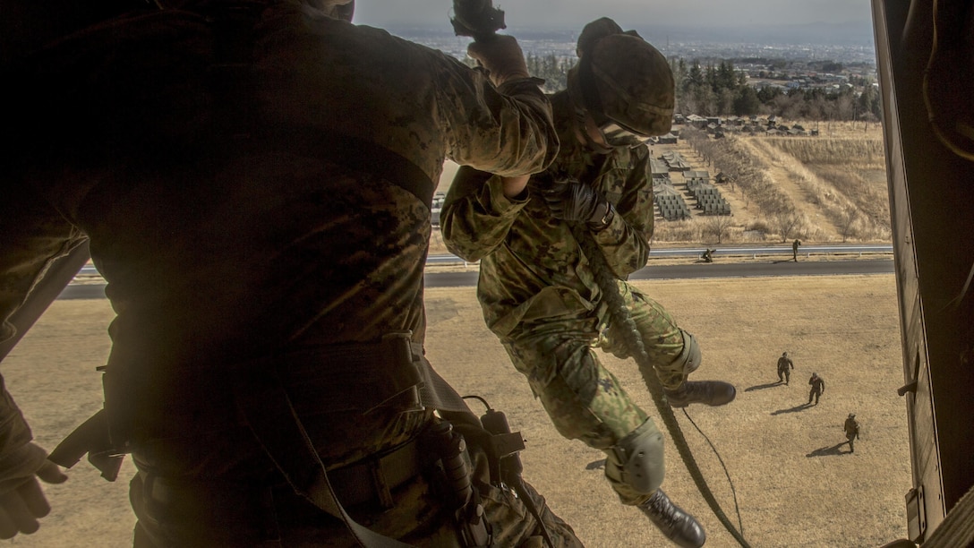A member of the Japanese Ground Self-Defense Force, 30th Infantry Regiment, 12th Brigade, Eastern Army fast ropes out of an MV-22B Osprey tiltrotor aircraft  during Forest Light 17-1 at Camp Soumagahara, Japan, on March 10, 2017. Forest Light is a routine, semi-annual exercise conducted by U.S. and Japanese forces in order to strengthen our interoperability and combined capabilities in defense of the U.S.-Japanese alliance.