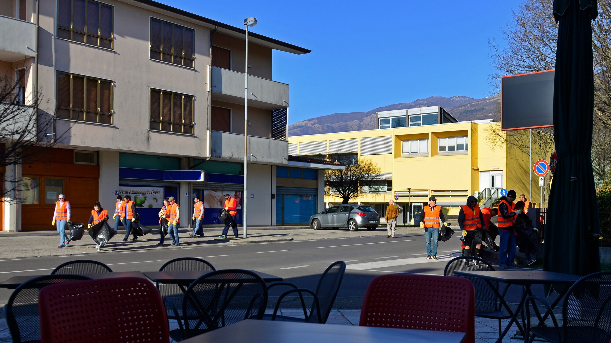 Volunteers from Aviano Air Base pick up trash during a city cleanup event in Aviano, March 12, 2017. The Airmen joined local Italians to walk the city streets and pick up trash. (U.S. Air Force photo by Senior Airman Cary Smith)