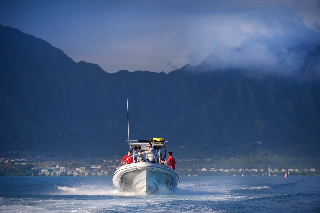 New York Air National Guardsmen and Human Space Flight Support Detachment 3 ride in a boat during training near Marine Corps Base Hawaii, March 5 2017. Air National Guard photo by Staff Sgt. Christopher Muncy