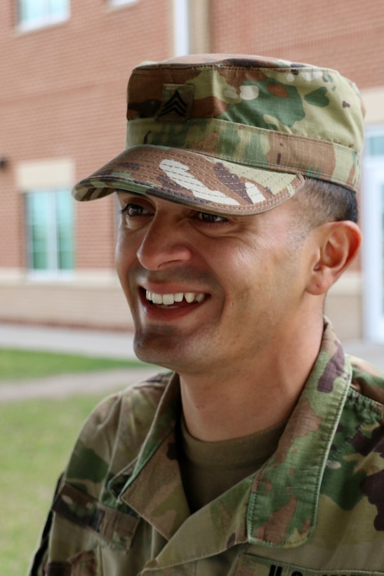 Army Sgt. Angel Cruz, multichannel transmission system operator-maintainer with 3rd Battalion, 15th Infantry Regiment, smiles as he discusses an upcoming retirement with a senior noncommissioned officer at Fort Stewart, Ga., March 6, 2017. Cruz re-enlisted Feb. 15, 2017. Army photo by Spc. Efren Rodriguez