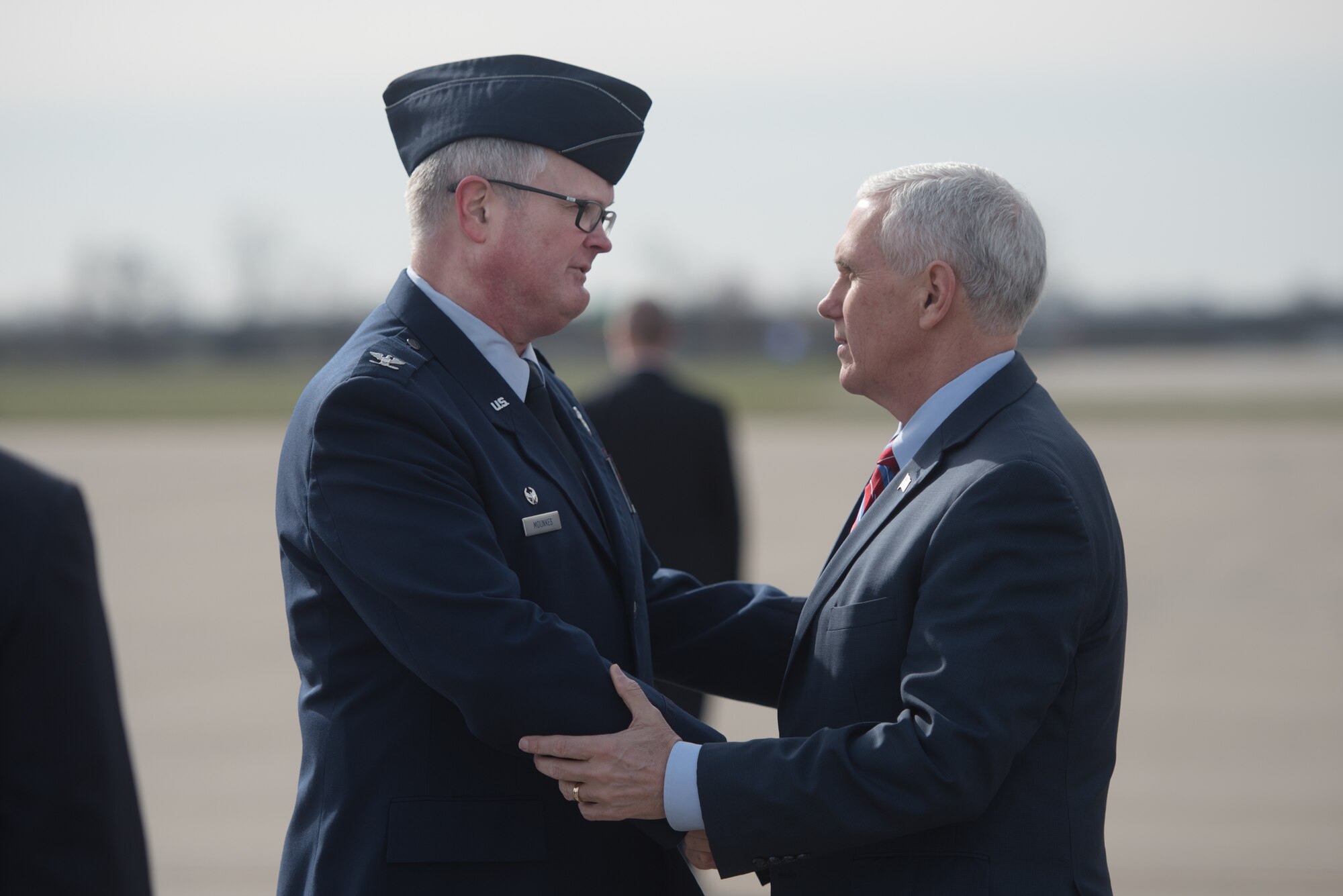 Col. David Mounkes (left), commander of the 123rd Airlift Wing, greets Vice President Mike Pence (right) at the Kentucky Air National Guard Base in Louisville, Ky., March 11, 2017. Pence was in Louisville to speak with local business leaders about health care and the economy. (U.S. Air National Guard photo by Staff Sgt. Joshua Horton)