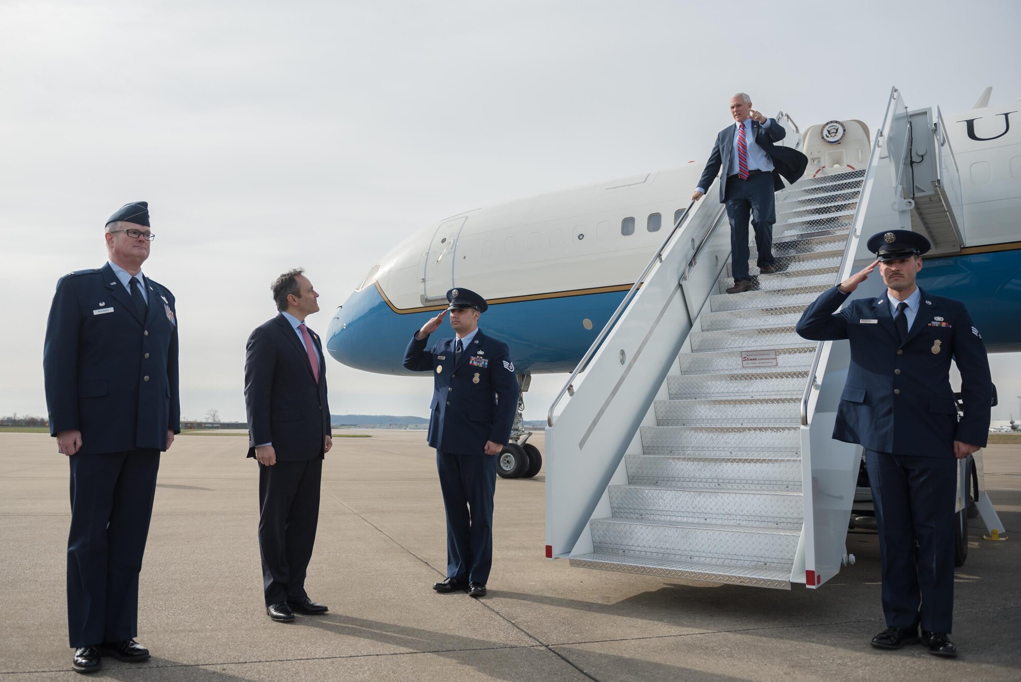 Col. David Mounkes (left), commander of the 123rd Airlift Wing, and Kentucky Gov. Matt Bevin (second from left) stand by to greet Vice President Mike Pence as he arrives at the Kentucky Air National Guard Base in Louisville, Ky., March 11, 2017. Pence was in Louisville to speak with local business leaders about health care and the economy. (U.S. Air National Guard photo by Staff Sgt. Joshua Horton)