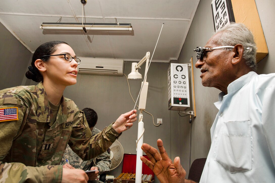 Army Capt. Frances M. Silva gives an eye exam to a patient at District General Hospital Hambantota as part of Pacific Partnership 2017 in Hambantota, Sri Lanka, March 8, 2017. Pacific Partnership is the largest annual multilateral humanitarian assistance and disaster relief preparedness mission conducted in the Indo-Asia-Pacific and aims to enhance regional coordination in areas such as medical readiness and preparedness for manmade and natural disasters. Navy photo by Petty Officer 2nd Class Chelsea Troy Milburn