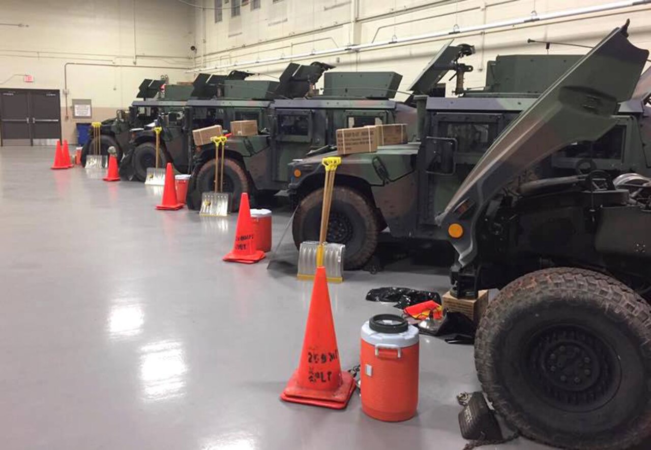 Virginia National Guard Soldiers assigned to the Manassas-based 266th Military Police Company, 1030th Transportation Battalion, 329th Regional Support Group line up vehicles for possible snow response operations March 13, 2017, in Manassas, Virginia. 