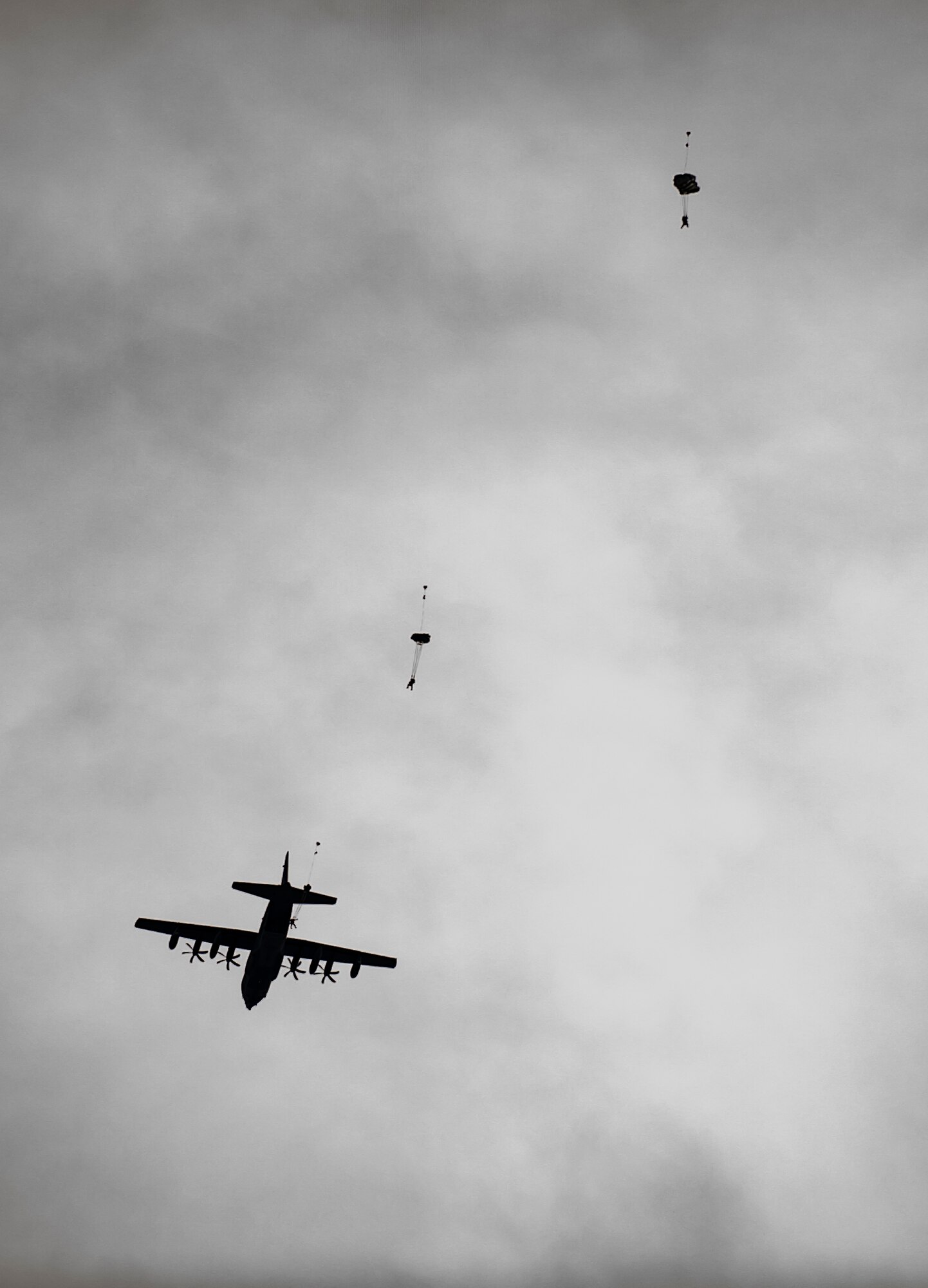 Parescuemen from the 308th Rescue Squadron, jump out of an HC-130J Combat King II to rescue a simulated patient behind enemy lines, March 2, 2017, at the Orchard Combat Training Center in Idaho, during pre-deployment training for the 305th Rescue Squadron. The 305th RQS, located at Davis-Monthan Air Force Base, Ariz., is conducting training at the Idaho Air National Guard’s Orchard Combat Training Center, a 143,000-acre live-fire range located south of Boise, Idaho, to hone all of their search and rescue procedures before heading to Southwest Asia. (U.S. Air Force photo/Staff Sgt. Jared Trimarchi)