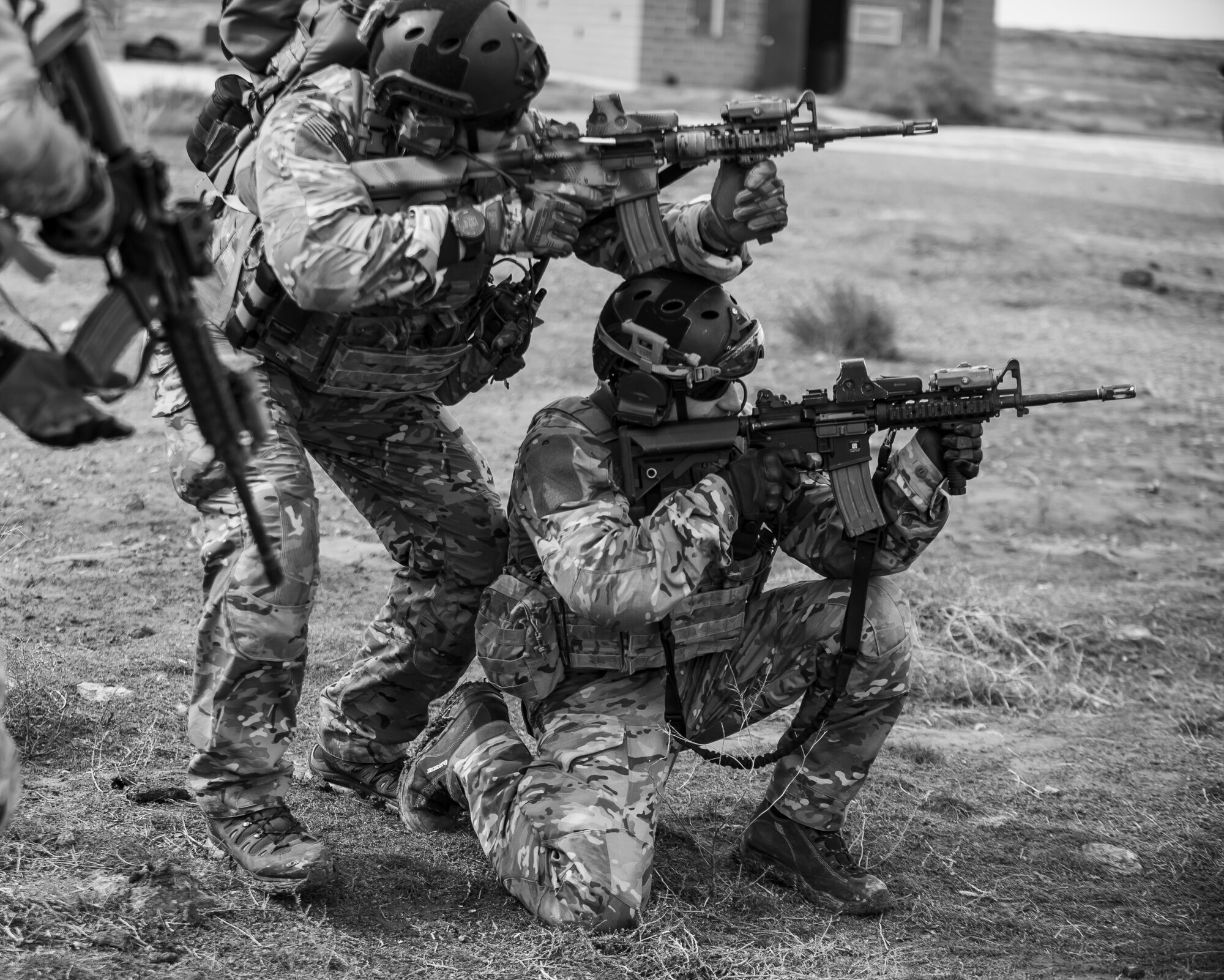 Two pararescueman, from the 308th Rescue Squadron, practice shooting tactics with simulated ammunition, March 2, 2017, at the Orchard Combat Training Center in Idaho, during pre-deployment training for the 305th Rescue Squadron. The 305th RQS, located at Davis-Monthan Air Force Base, Ariz., is conducting training at the Idaho Air National Guard’s Orchard Combat Training Center, a 143,000-acre live-fire range located south of Boise, Idaho, to hone all of their search and rescue procedures before heading to Southwest Asia. (U.S. Air Force photo/Staff Sgt. Jared Trimarchi)