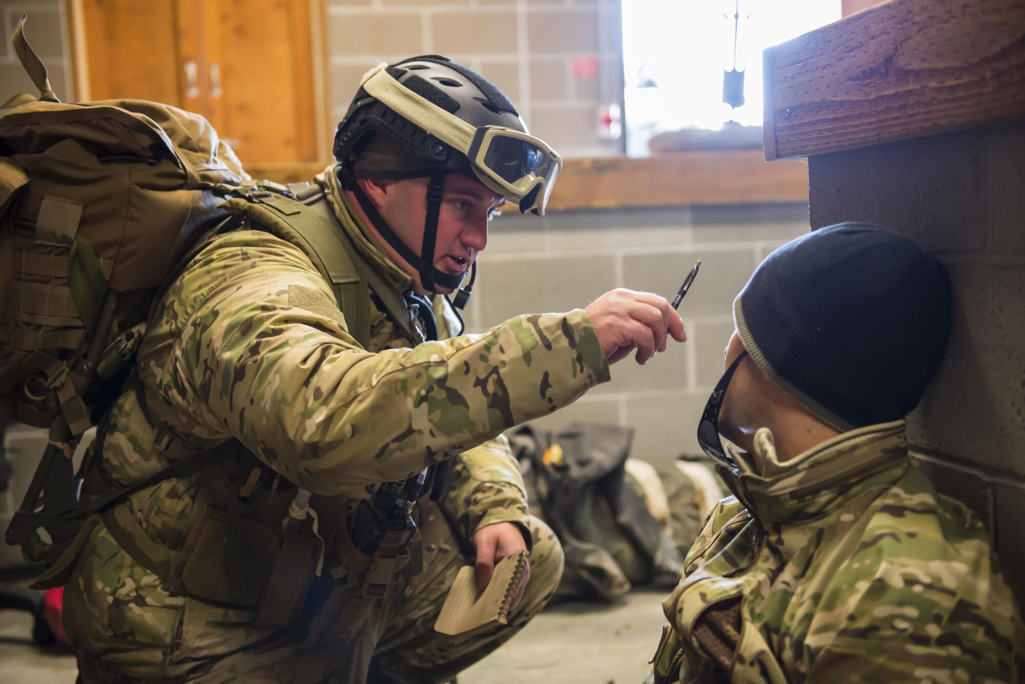 Tech. Sgt. Louis Hause, a pararescueman with the 308th Rescue Squadron, diagnosis a simulated improvised explosive ordnance victim, March 2, 2017, at the Orchard Combat Training Center in Idaho, during pre-deployment training for the 305th Rescue Squadron. The 305th RQS, located at Davis-Monthan Air Force Base, Ariz., is conducting training at the Idaho Air National Guard’s Orchard Combat Training Center, a 143,000-acre live-fire range located south of Boise, Idaho, to hone all of their search and rescue procedures before heading to Southwest Asia. (U.S. Air Force photo/Staff Sgt. Jared Trimarchi)
 
