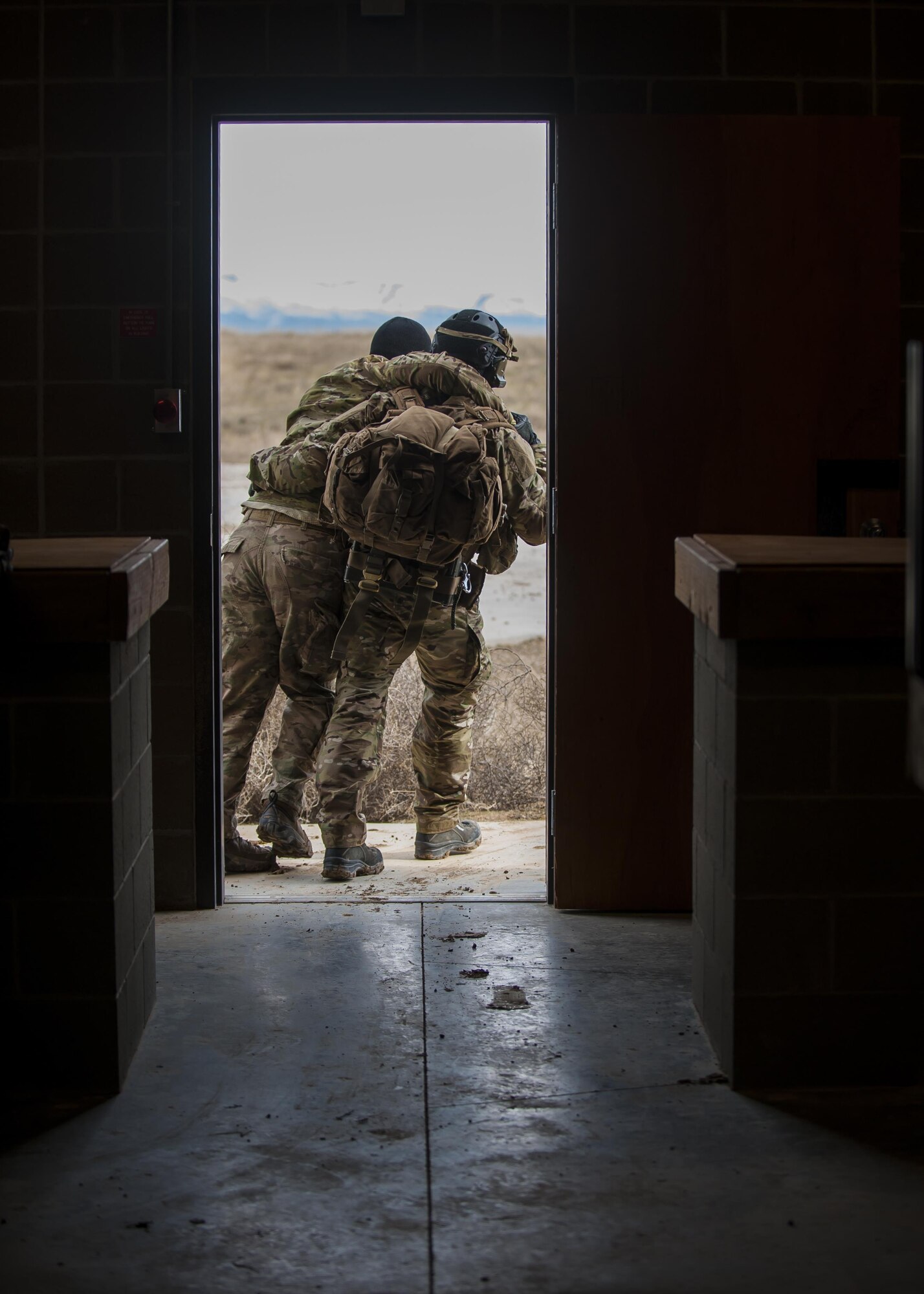 A pararescueman with the 308th Rescue Squadron, helps carry a simulated improvised explosive ordnance victim to safety, March 2, 2017, at the Orchard Combat Training Center in Idaho, during pre-deployment training for the 305th Rescue Squadron. The 305th RQS, located at Davis-Monthan Air Force Base, Ariz., is conducting training at the Idaho Air National Guard’s Orchard Combat Training Center, a 143,000-acre live-fire range located south of Boise, Idaho, to hone all of their search and rescue procedures before heading to Southwest Asia. (U.S. Air Force photo/Staff Sgt. Jared Trimarchi)