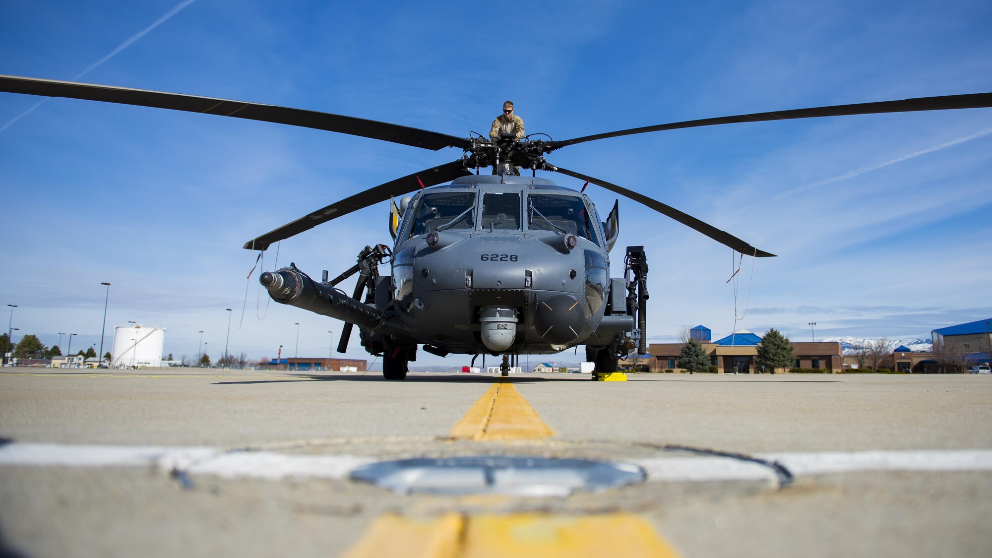 Master Sgt. Trevor Stevens, from the 943rd Rescue Group, examines the rotors of an HH-60G Pave Hawk helicopter, March 3, 2017, at Gowen Field, Idaho, during pre-deployment training for the 305th Rescue Squadron. The 305th RQS, located at Davis-Monthan Air Force Base, Ariz., is conducting training at the Idaho Air National Guard’s Orchard Combat Training Center, a 143,000-acre live-fire range located south of Boise, Idaho, to hone all of their search and rescue procedures before heading to Southwest Asia. (U.S. Air Force photo/Staff Sgt. Jared Trimarchi)