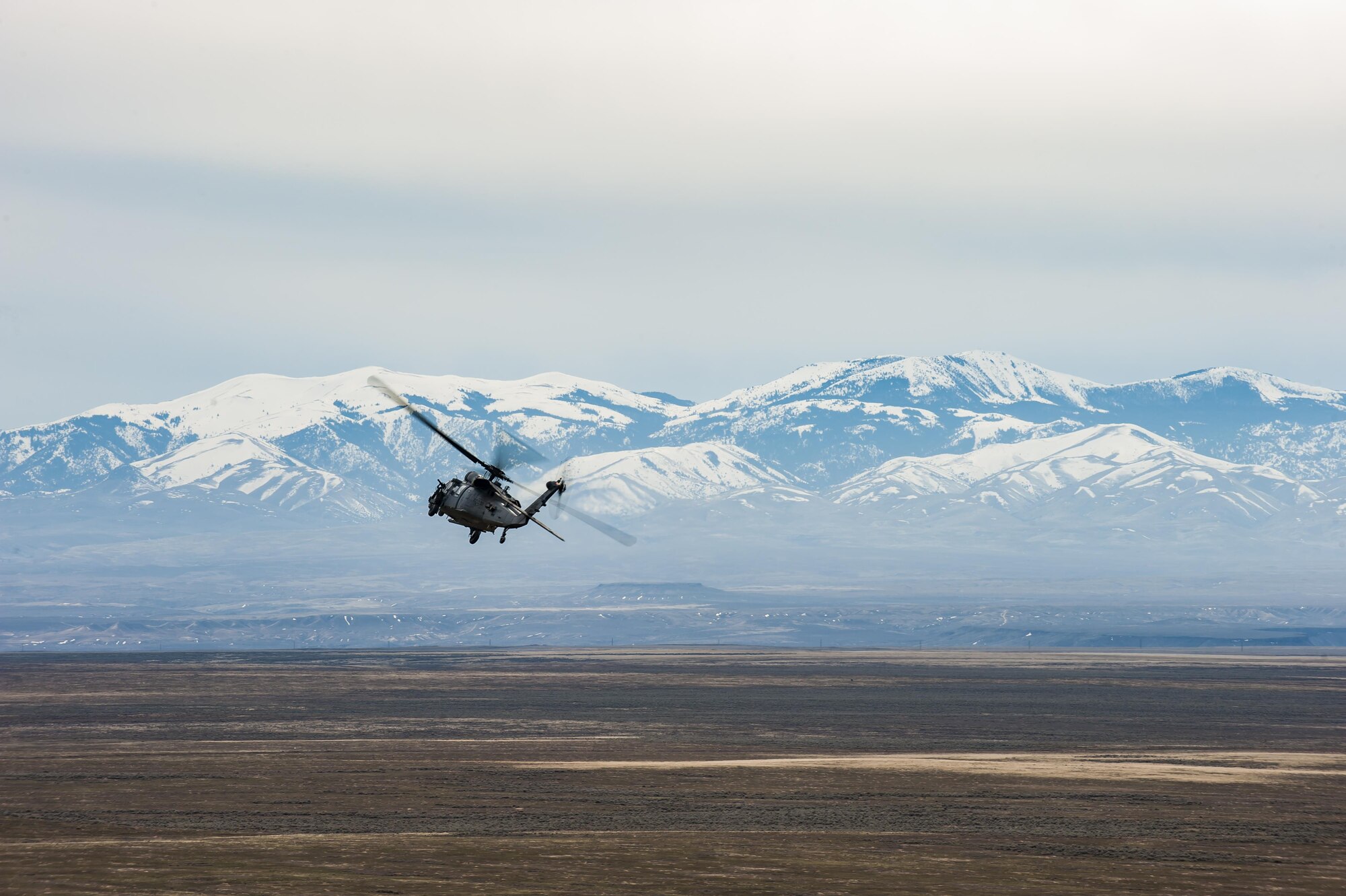 An HH-60G Pave Hawk helicopter practices search and rescue operations, March 3, 2017, at the Orchard Combat Training Center in Idaho, during pre-deployment training for the 305th Rescue Squadron. The 305th RQS, located at Davis-Monthan Air Force Base, Ariz., is conducting training at the Idaho Air National Guard’s Orchard Combat Training Center, a 143,000-acre live-fire range located south of Boise, Idaho, to hone all of their skills before heading to Southwest Asia. (U.S. Air Force photo/Staff Sgt. Jared Trimarchi)