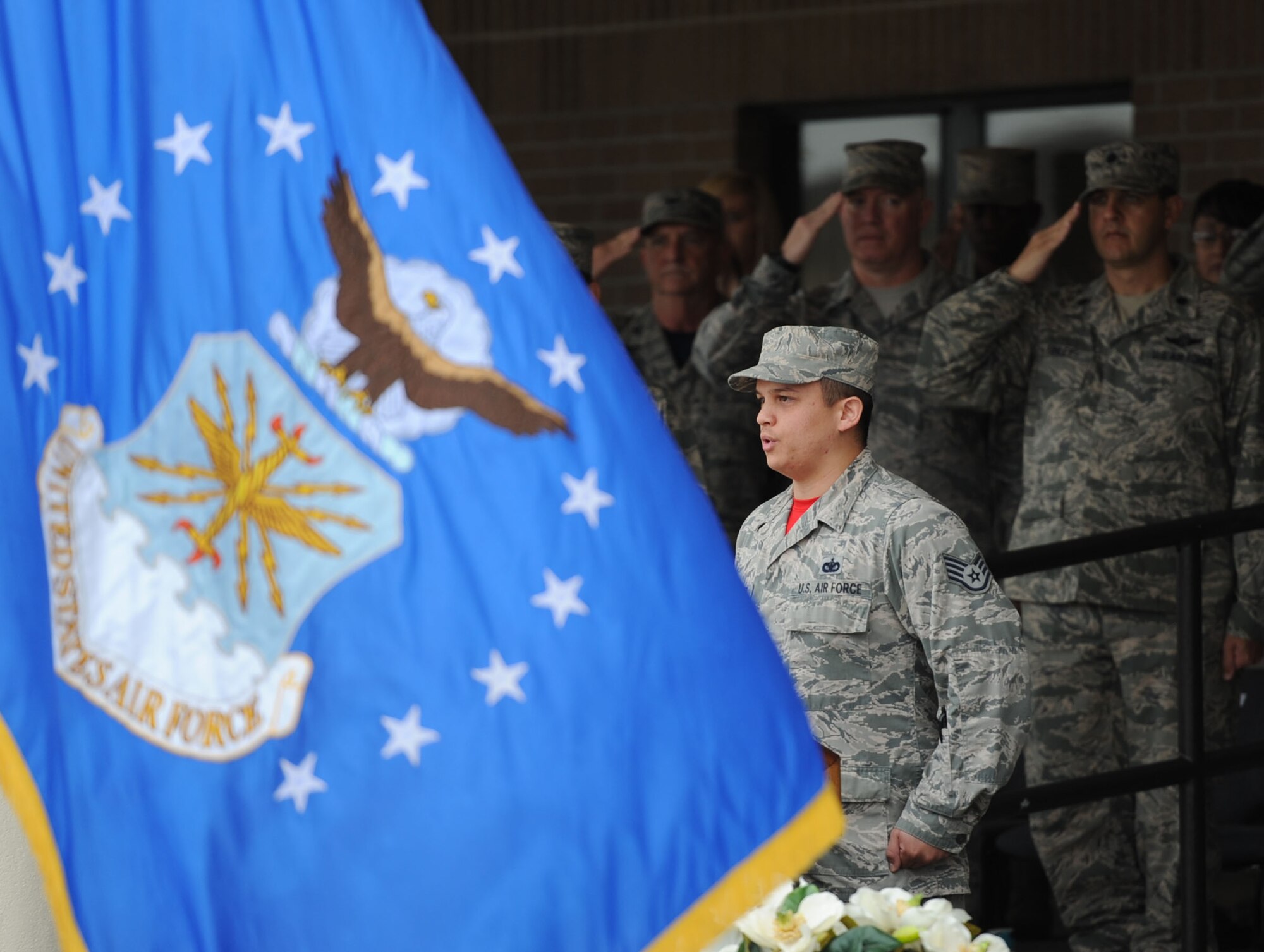 Staff Sgt. John Andelfinger, 336th Training Squadron student, sings the national anthem during the 81st Training Group drill down at the Levitow Training Support Facility drill pad March 10, 2017, on Keesler AFB, Miss. Airmen from the 81st TRG competed in a quarterly open ranks inspection, regulation drill routine and freestyle drill routine with the 334th Training Squadron “Gators” taking first place. (U.S. Air Force photo by Kemberly Groue)