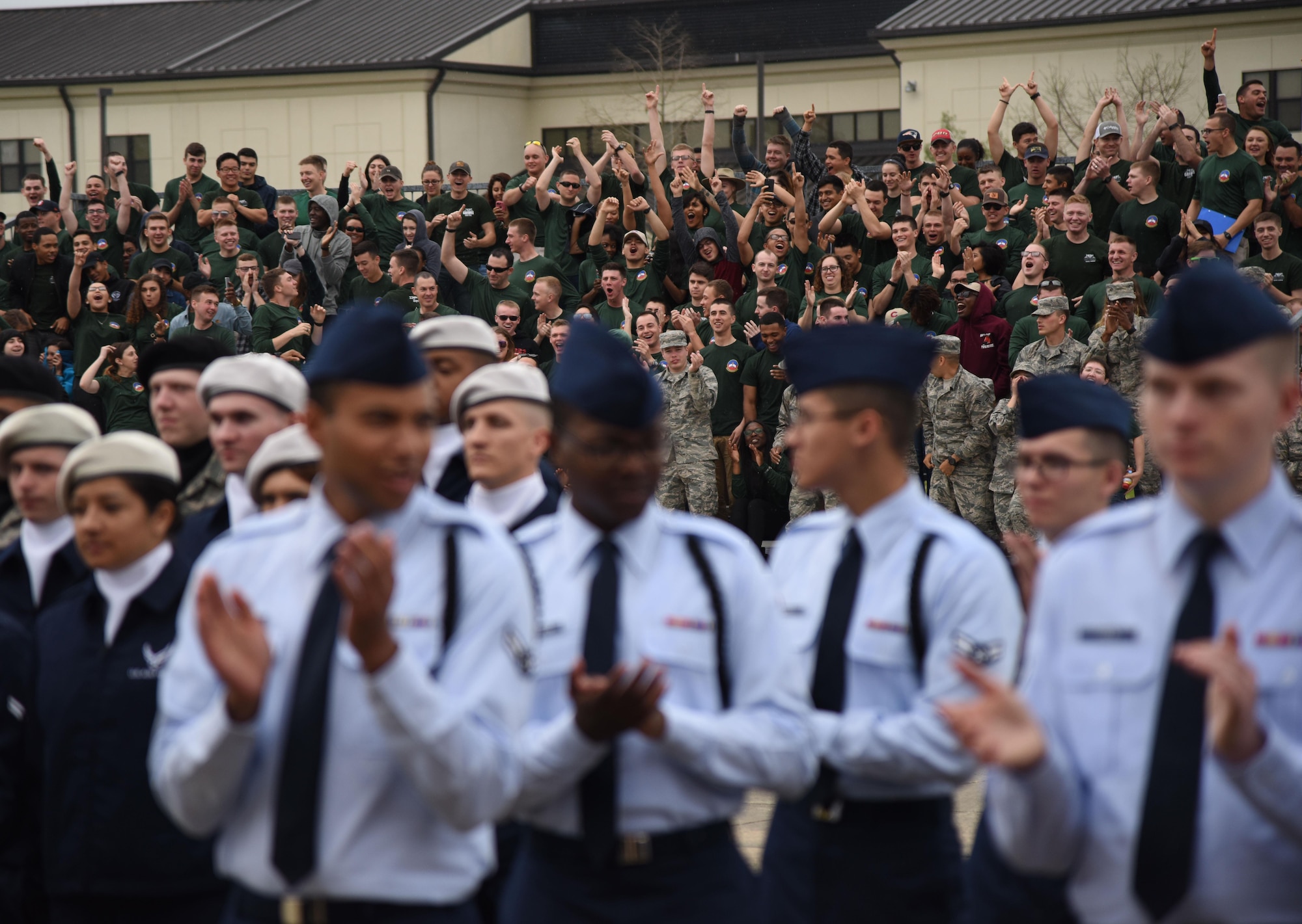 Members of the 334th Training Squadron cheer during the 81st Training Group drill down at the Levitow Training Support Facility drill pad March 10, 2017, on Keesler Air Force Base, Miss. Airmen from the 81st TRG competed in a quarterly open ranks inspection, regulation drill routine and freestyle drill routine with the 334th TRS “Gators” taking first place. (U.S. Air Force photo by Kemberly Groue)