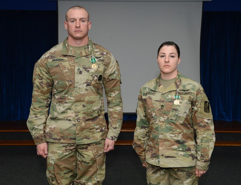 U.S. Army Staff Sgt. Mathew Johnson, Charlie Company, 210th Aviation Regiment, 128th Aviation Brigade instructor earned the title of NCO of the Year and U.S. Army Staff Sgt. Brittany Barfield, Delta Co., 222nd Aviation Reg., 128th Avn. Bde. platoon sergeant earned the title of Advanced Individual Training Platoon Sergeant of the Year at Joint Base Langley-Eustis, Va., March 9, 2017. Johnson and Barfield will represent the 128th Avn. Bde. during the U.S. Army Aviation Center of Excellence’s competition at Fort Rucker, Ala. (U.S. Air Force photo/Airman 1st Class Kaylee Dubois)