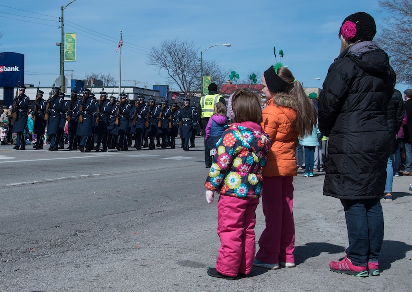 Onlookers watch the U.S. Air Force Honor Guard march during the South Side Irish St. Patrick’s Day Parade in Chicago, March 12, 2017. The team also participated in the Chicago Saint Patrick’s Day Parade during the trip. Their role in both annual events was to represent the Air Force and its Airmen to the American public and the world through their discipline, attention to detail and service to the country. (U.S. Air Force photo by Senior Airman Jordyn Fetter)