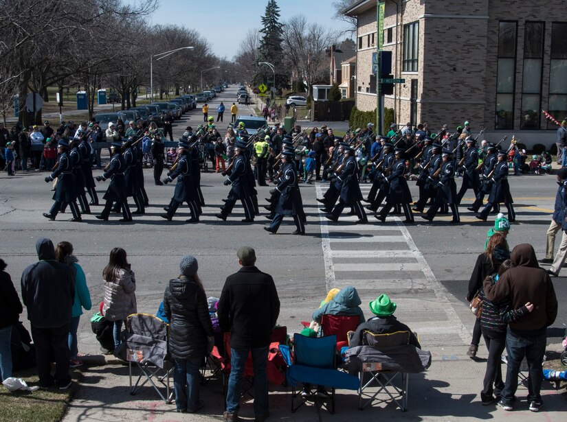 The U.S. Air Force Honor Guard marches in the South Side Irish St. Patrick’s Day Parade in Chicago, March 12, 2017. In preparation for the parade, the team practiced their formation by marching a mock parade route around their compound in addition to training five days a week and performing ceremonies on a regular basis. (U.S. Air Force photo by Senior Airman Jordyn Fetter) 