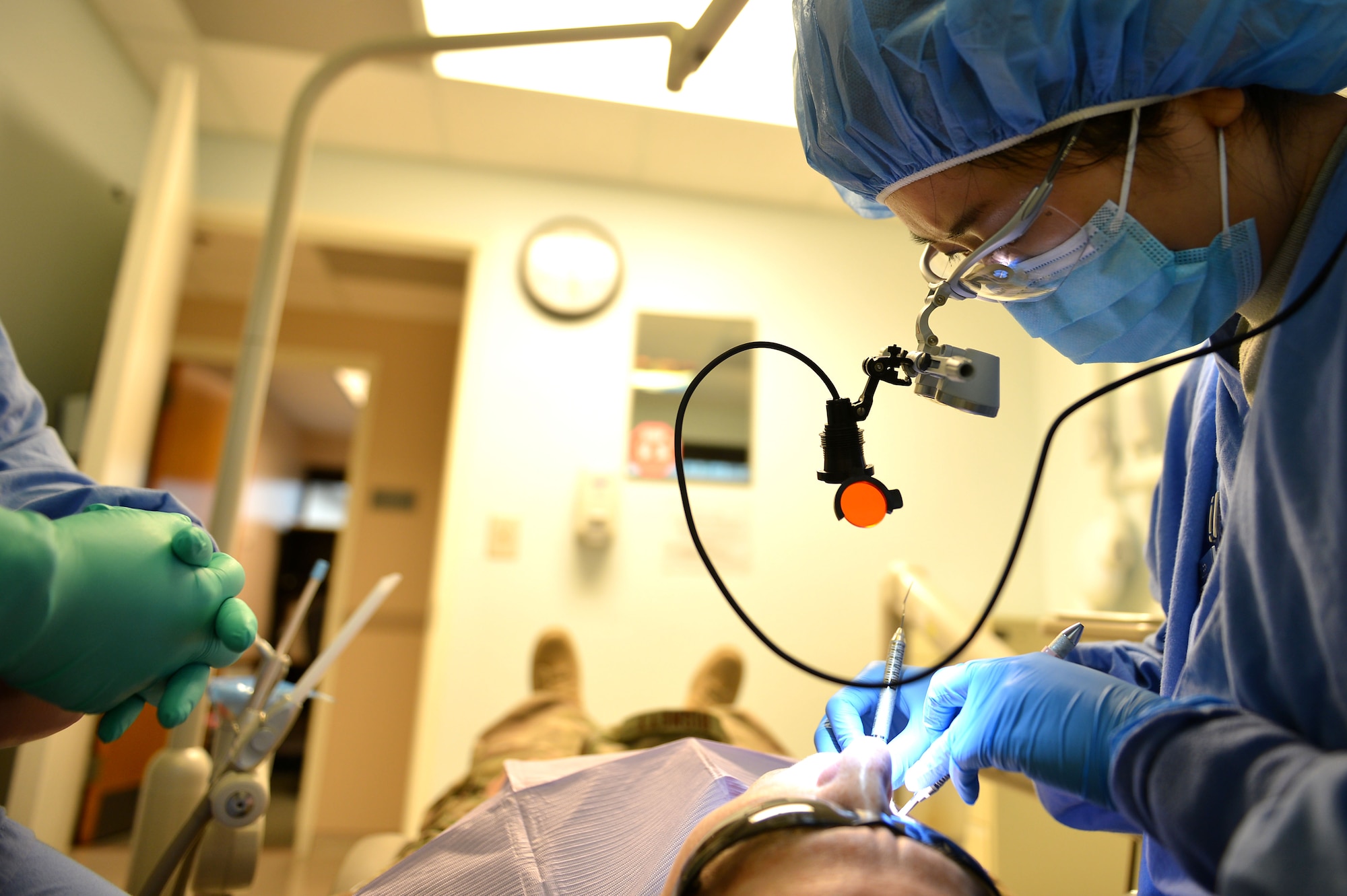 U.S. Air Force Capt. Sarah Curry, 20th Dental Squadron general dentist, repairs a filling for Col. Teresa Bisnett, 9th Air Force command surgeon, at Shaw Air Force Base, S.C., March 13, 2017. Airmen assigned to the 20th DS provide various services to include oral surgeries and endodontics such as root canals, crown implants and fillings. (U.S. Air Force photo by Airman 1st Class Christopher Maldonado)