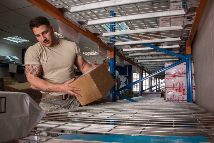 Air Force Airman Brent Downs, a 386th Expeditionary Logistics Readiness Squadron supply journeyman, places a box in its designated location at the post office at the 386th Air Expeditionary Wing’s deployed location in Southwest Asia, March 11, 2017. Post office contractors and volunteers sort and stow mail not only for the 386th, but for other branches and coalition partners around base. Air Force photo by Senior Airman Andrew Park