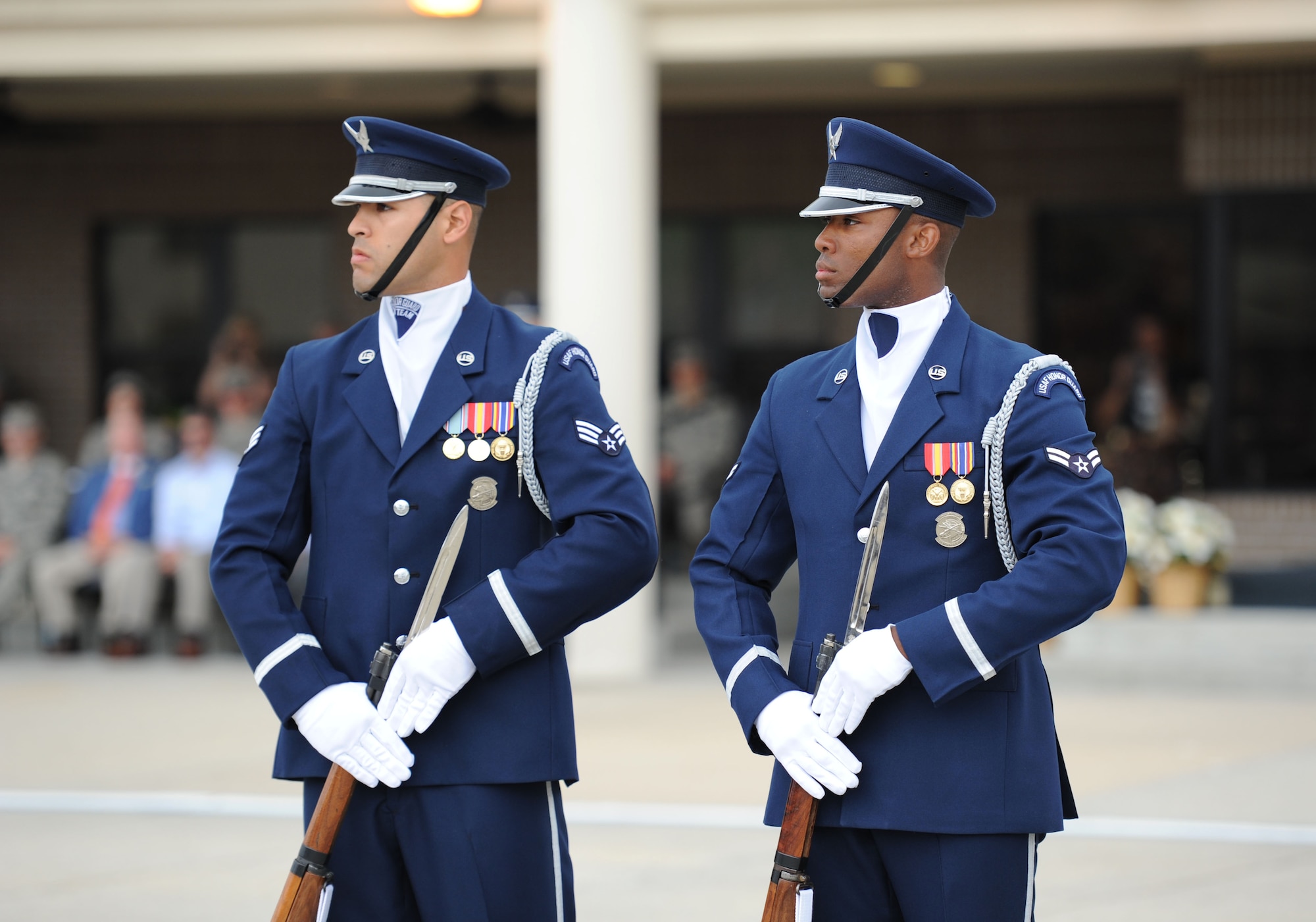 Senior Airman Ryan Garrido and Airman 1st Class Nigel Jaggard, U.S. Air Force Honor Guard Drill Team members, debut their 2017 routine during the 81st Training Group drill down at the Levitow Training Support Facility drill pad March 10, 2017, on Keesler Air Force Base, Miss. The team comes to Keesler every year for five weeks to develop a new routine that they will use throughout the year. (U.S. Air Force photo by Kemberly Groue)