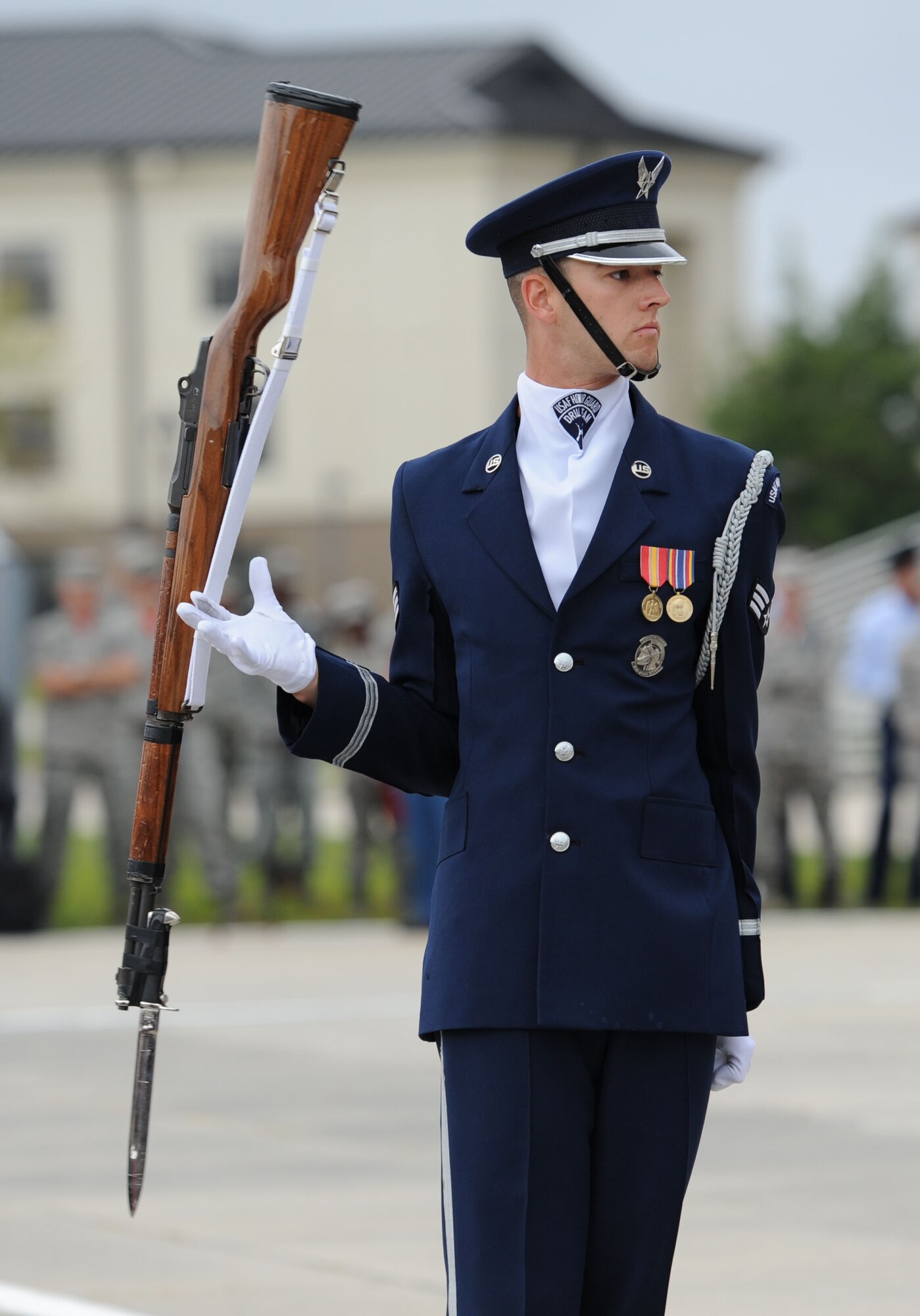 Senior Airman Joshua Blanton, U.S. Air Force Honor Guard Drill Team member, spins a rifle while debuting  the team’s 2017 routine during the 81st Training Group drill down at the Levitow Training Support Facility drill pad March 10, 2017, on Keesler Air Force Base, Miss. The team comes to Keesler every year for five weeks to develop a new routine that they will use throughout the year. (U.S. Air Force photo by Kemberly Groue)