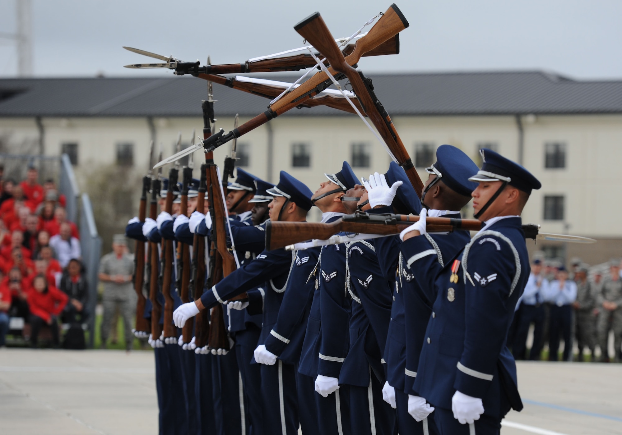 The U.S. Air Force Honor Guard Drill Team debuts their 2017 routine during the 81st Training Group drill down at the Levitow Training Support Facility drill pad March 10, 2017, on Keesler Air Force Base, Miss. The team comes to Keesler every year for five weeks to develop a new routine that they will use throughout the year. (U.S. Air Force photo by Kemberly Groue)