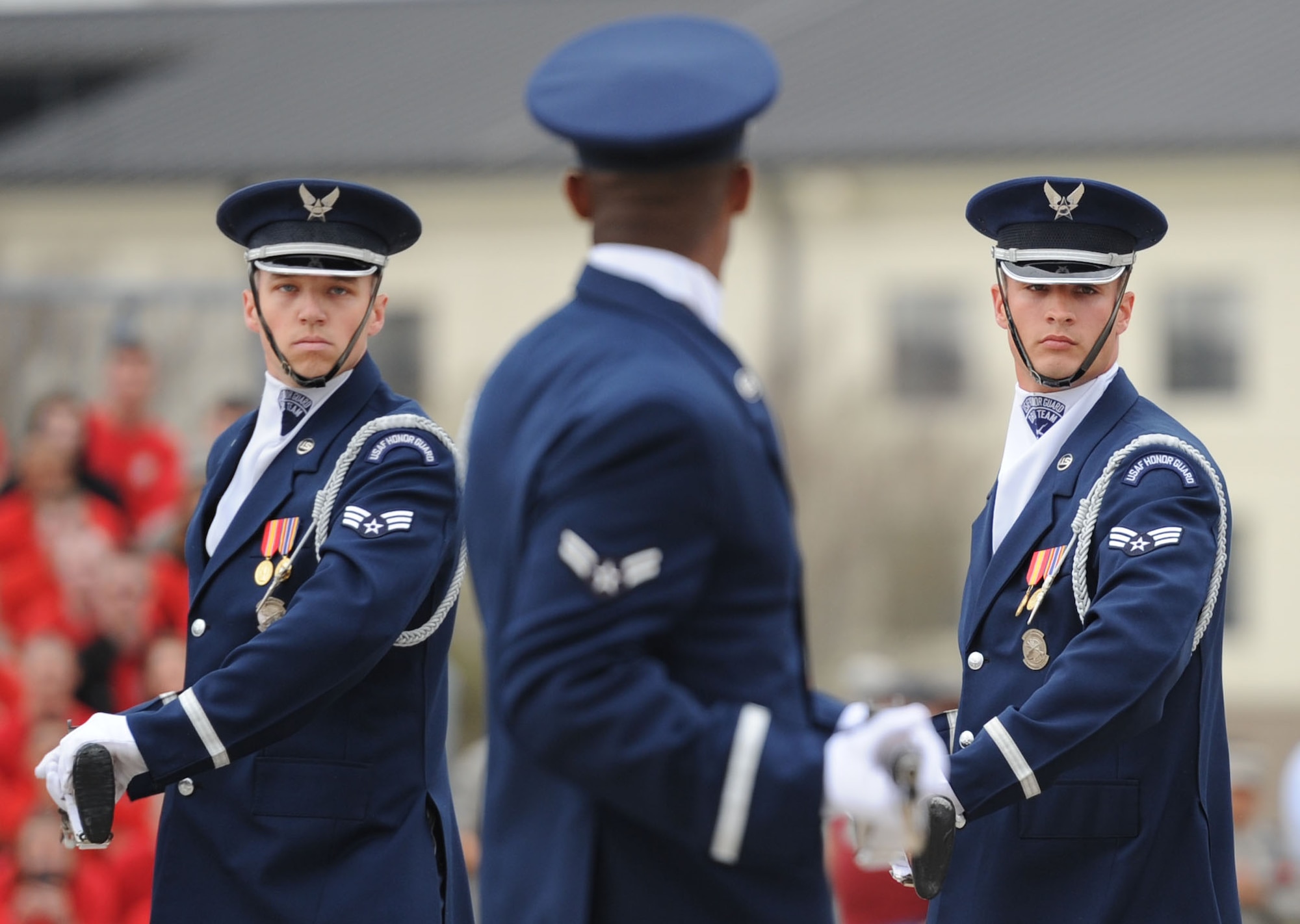 Senior Airman Scott Gricius, Airman 1st Class Nigel Jaggard and Senior Airman Tyler Reynolds, U.S. Air Force Honor Guard Drill Team members, debut the team’s 2017 routine during the 81st Training Group drill down at the Levitow Training Support Facility drill pad March 10, 2017, on Keesler Air Force Base, Miss. The team comes to Keesler every year for five weeks to develop a new routine that they will use throughout the year. (U.S. Air Force photo by Kemberly Groue)