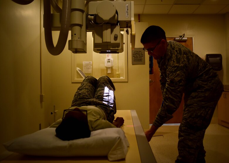 U.S. Air Force Airman 1st Class John Dennis, 633rd Surgical Operations Squadron diagnostics imaging technologist, performs an x-ray on a patient, at Joint Base Langley-Eustis, Va., Feb. 21, 2017. Airmen assigned to the 633rd SGCS radiology department are equipped with the technology needed to provide images, assisting doctors in performing diagnosis and giving trusted care to patients in the medical clinic, surgical department and emergency room, 24 hours a day. (U.S. Air Force photo/Senior Airman Areca T. Bell) 