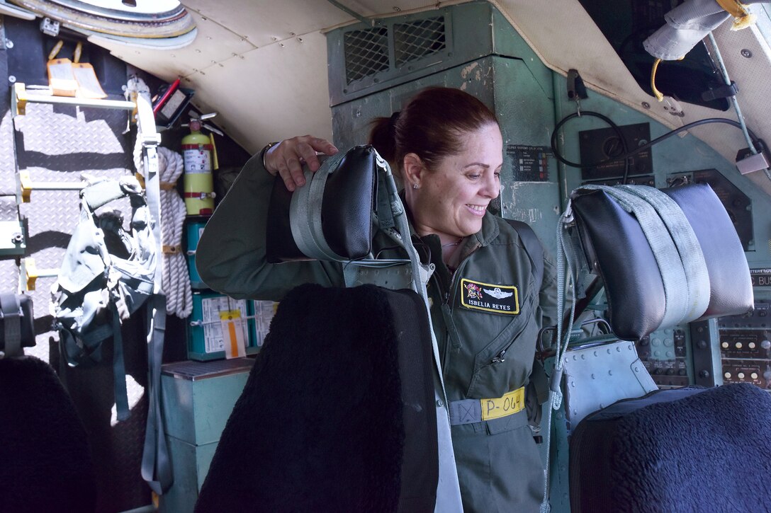 Puerto Rico Air National Guard Maj. Isbelia Reyes, aircraft commander, talks to her flight crew inside a C-130 Hercules before a mission to commemorate International Women's Day at Muñiz Air National Guard Base, Puerto Rico, March 8, 2017. Air National Guard photo by Staff Sgt. Angel Oquendo