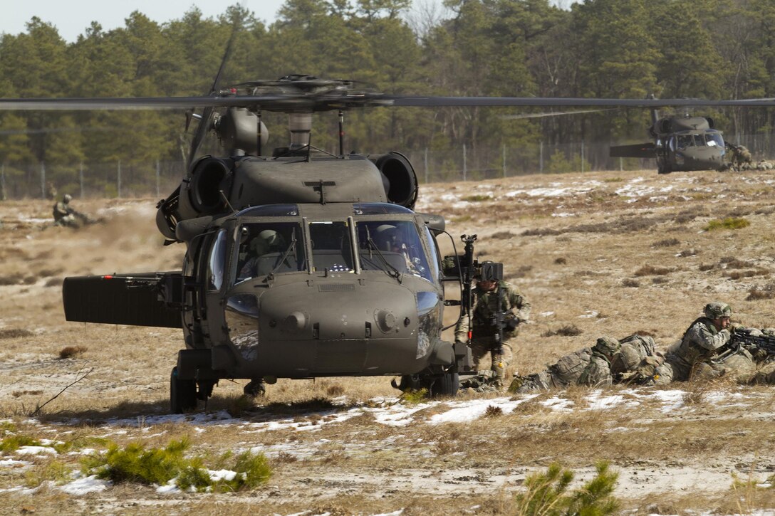 U.S. Army Soldiers assigned to Easy Company, 2nd Battalion, 506th Parachute Infantry Regiment, 101st Airborne Division (Air Assault) exit out of an Army Reserve UH-60 Black Hawk helicopter from 8th Battalion, 229th Aviation Regiment, based out of Fort Knox, Ky., at Lakehurst Maxfield Field during a multi-component airfield seizure training exercise between the Army Reserve and the 101st Airborne Division (Air Assault) on March 13, 2017, to kick off Warrior Exercise 78-17-01. Several Army Reserve organizations including the Army Reserve Aviation Command, 84th Training Command, 78th Training Division, and members of the 200th Military Police Command helped Easy Company, 2nd Battalion, 506th Parachute Infantry Regiment, 101st Airborne Division conduct the mission. Roughly 60 units from the U.S. Army Reserve, U.S. Army, U.S. Air Force, and Canadian Armed Forces are participating in the 84th Training Command’s joint training exercise, WAREX 78-17-01, at Joint Base McGuire-Dix-Lakehurst from March 8 until April 1, 2017; the WAREX is a large-scale collective training event designed to assess units’ combat capabilities as America’s Army Reserve continues to build the most capable, combat-ready, and lethal Federal Reserve force in the history of the Nation. (Army Reserve Photo by Master Sgt. Mark Bell / Released)