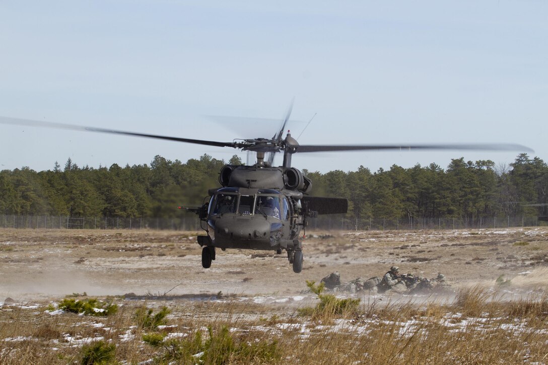 U.S. Army Soldiers assigned to Easy Company, 2nd Battalion, 506th Parachute Infantry Regiment, 101st Airborne Division (Air Assault) provide security after exiting out of an Army Reserve UH-60 Black Hawk helicopter from 8th Battalion, 229th Aviation Regiment, based out of Fort Knox, Ky., at Lakehurst Maxfield Field during a multi-component airfield seizure training exercise between the Army Reserve and the 101st Airborne Division (Air Assault) on March 13, 2017, to kick off Warrior Exercise 78-17-01. Several Army Reserve organizations including the Army Reserve Aviation Command, 84th Training Command, 78th Training Division, and members of the 200th Military Police Command helped Easy Company, 2nd Battalion, 506th Parachute Infantry Regiment, 101st Airborne Division conduct the mission. Roughly 60 units from the U.S. Army Reserve, U.S. Army, U.S. Air Force, and Canadian Armed Forces are participating in the 84th Training Command’s joint training exercise, WAREX 78-17-01, at Joint Base McGuire-Dix-Lakehurst from March 8 until April 1, 2017; the WAREX is a large-scale collective training event designed to assess units’ combat capabilities as America’s Army Reserve continues to build the most capable, combat-ready, and lethal Federal Reserve force in the history of the Nation. (Army Reserve Photo by Master Sgt. Mark Bell / Released)