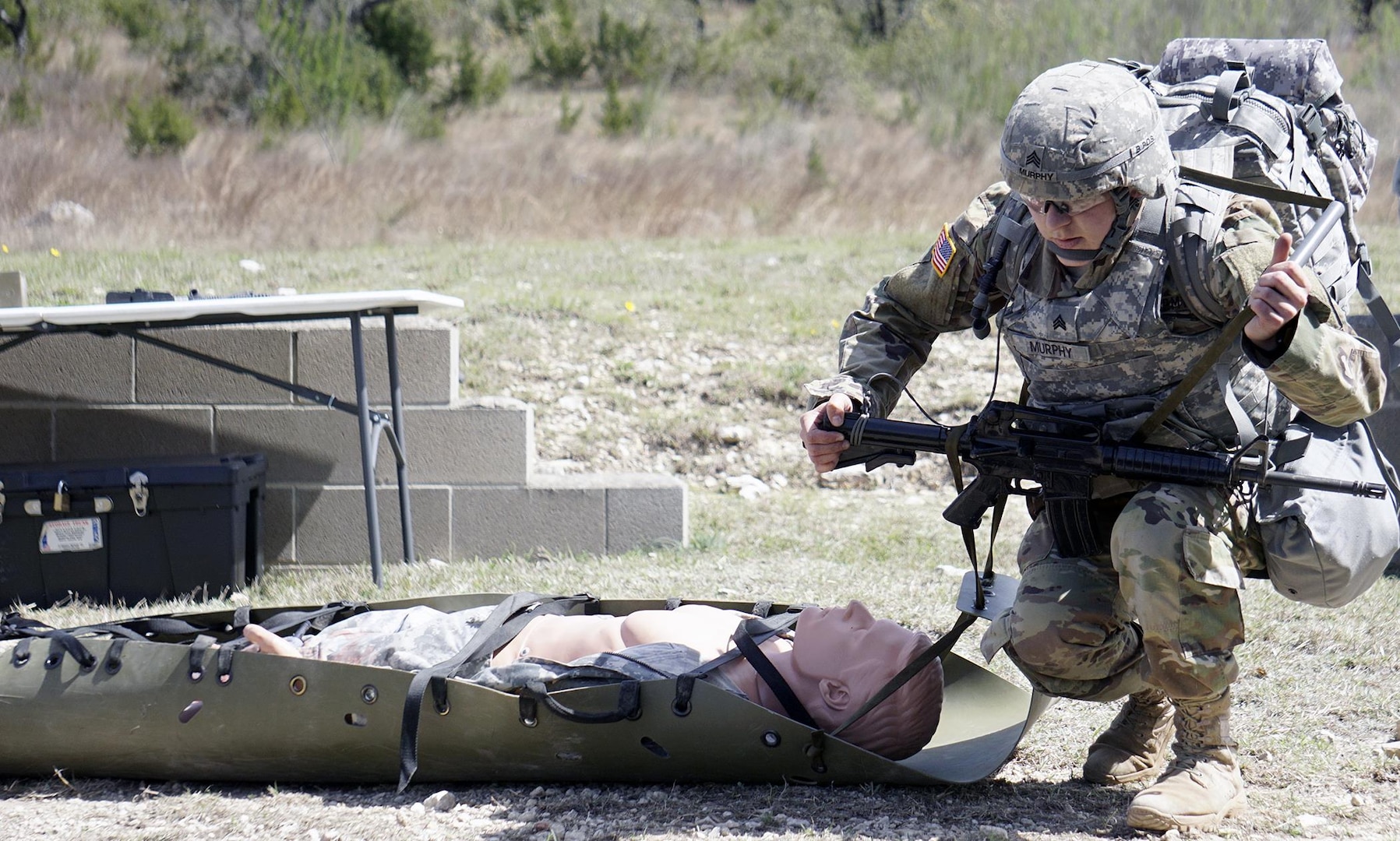 Sgt. Ashley Murphy, Fort Hood Dental Activity, prepares to evacuate a casualty during Army Warrior Task Lane during the Regional Best Warrior Competition hosted by the Joint Base San Antonio-Fort Sam Houston Dental Health Activity, or DENTAC, from Feb. 27 to March 3 at JBSA-Camp Bullis. 
