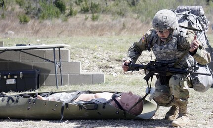 Sgt. Ashley Murphy, Fort Hood Dental Activity, prepares to evacuate a casualty during Army Warrior Task Lane during the Regional Best Warrior Competition hosted by the Joint Base San Antonio-Fort Sam Houston Dental Health Activity, or DENTAC, from Feb. 27 to March 3 at JBSA-Camp Bullis. 