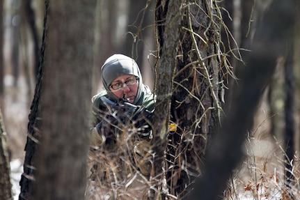 Acting as the enemy force, Sgt. Kyle Ison, an Army Reserve Soldier assigned to the 363rd Military Police Company, engages Soldiers from the 101st Airborne Division (Air Assault) at Lakehurst Maxfield Field during a multi-component airfield seizure training exercise between the Army Reserve and the 101st Airborne Division on March 13, 2017 to kick off Warrior Exercise 78-17-01. Several Army Reserve organizations including the Army Reserve Aviation Command, 84th Training Command, 78th Training Division, and members of the 200th Military Police Command helped Easy Company, 2nd Battalion, 506th Parachute Infantry Regiment, 101st Airborne Division conduct the mission. Roughly 60 units from the U.S. Army Reserve, U.S. Army, U.S. Air Force, and Canadian Armed Forces are participating in the 84th Training Command’s joint training exercise, WAREX 78-17-01, at Joint Base McGuire-Dix-Lakehurst from March 8 until April 1, 2017; the WAREX is a large-scale collective training event designed to assess units’ combat capabilities as America’s Army Reserve continues to build the most capable, combat-ready, and lethal Federal Reserve force in the history of the Nation. (Army Reserve Photo by Sgt. Stephanie Ramirez/ Released)