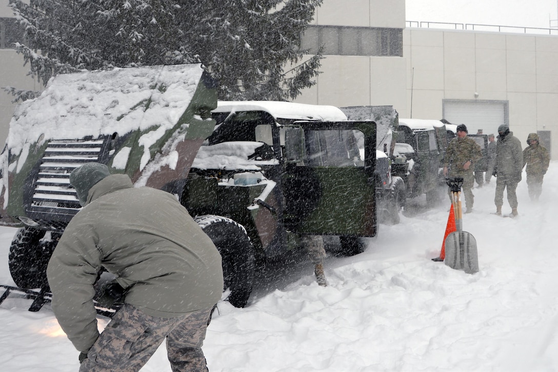 New York Army National Guard soldiers from the 42nd Combat Aviation Brigade prepare their humvees for missions as a massive snowstorm hits New York, March 14, 2017.  Army National Guard photo by Sgt. Maj. Corine Lombardo