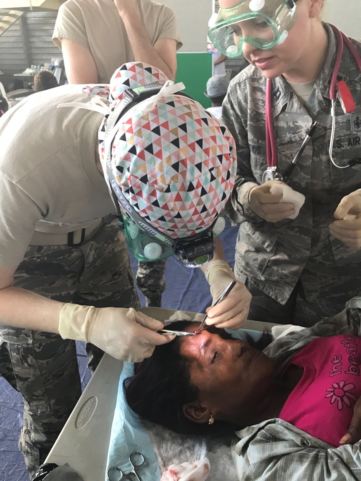 Capt. Natasha Lewis, 21st Medical Group nurse, provides medical attention to a patient in Azua, Dominican Republic, during Operation New Horizons, an exercise run by Air Force South, March 3-18, 2017. Lewis is part of a team from Peterson Air Force Base, Colo., that is leading the initial set up phase of the operation for the first time in its 19 year history. (Courtesy photo)