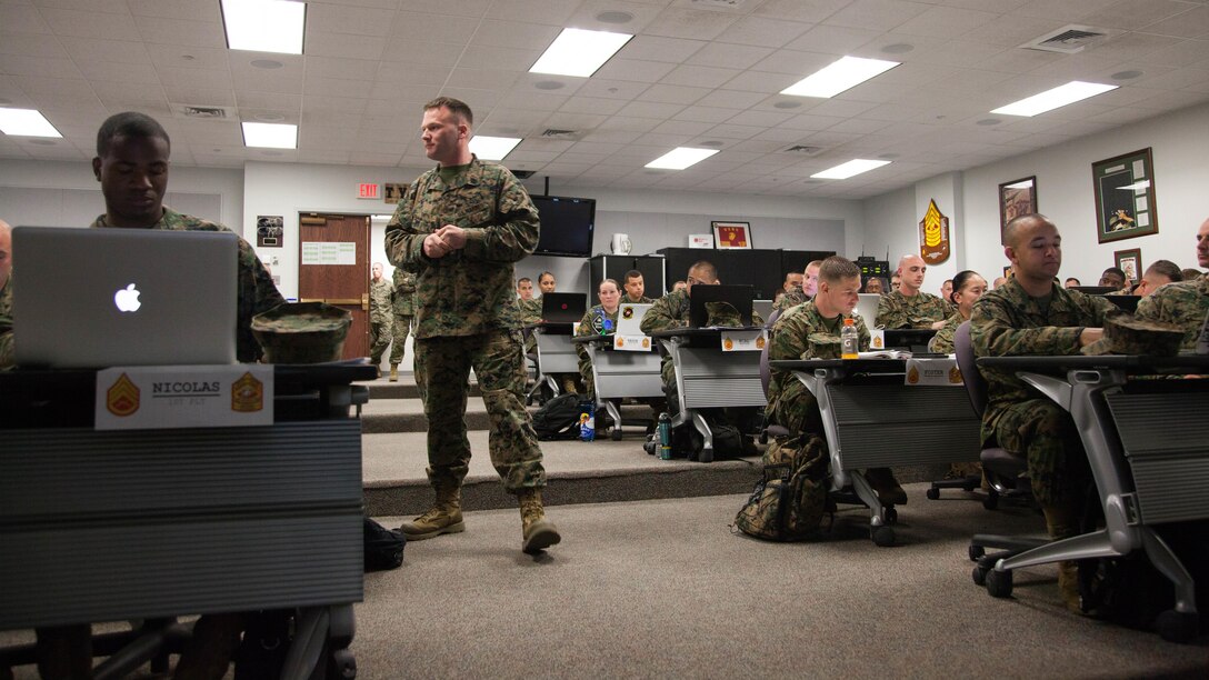 Gunnery Sgt. Lawrence Smith, a faculty advisor at the Marine Corps Base Quantico Staff Noncommissioned Officer Academy, leads a guided discussion during a Career Course classroom session at MCB Quantico, Virginia, Mar. 8, 2017. Enlisted Marines come to Quantico in order to be qualified and teach as a faculty advisor, a role that helps facilitate hundreds of Marines a year in their resident professional military education.