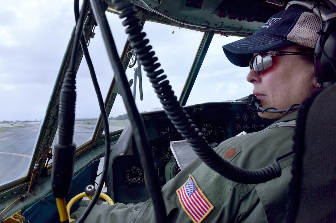 Puerto Rico Air National Guard Maj. Isbelia Reyes, aircraft commander, taxis her C-130 Hercules to the flightline before a mission to commemorate International Women's Day at Muñiz Air National Guard Base, Puerto Rico, March 9, 2017. Air National Guard photo by Master Sgt. Edgar Morell