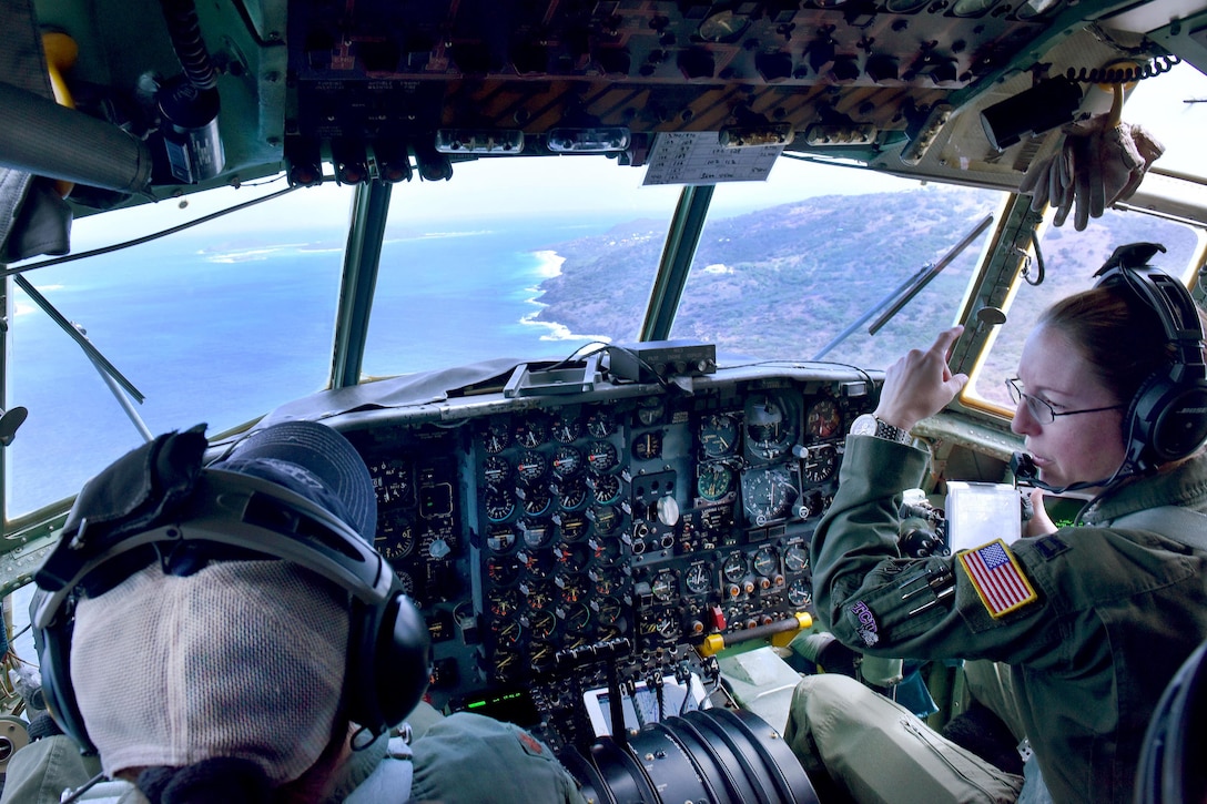 Puerto Rico Air National Guard Maj. Isbelia Reyes, left, and Capt. Heather Kindred fly a C-130 Hercules over Puerto Rico, March 9, 2017. Air National Guard photo by Master Sgt. Edgar Morell