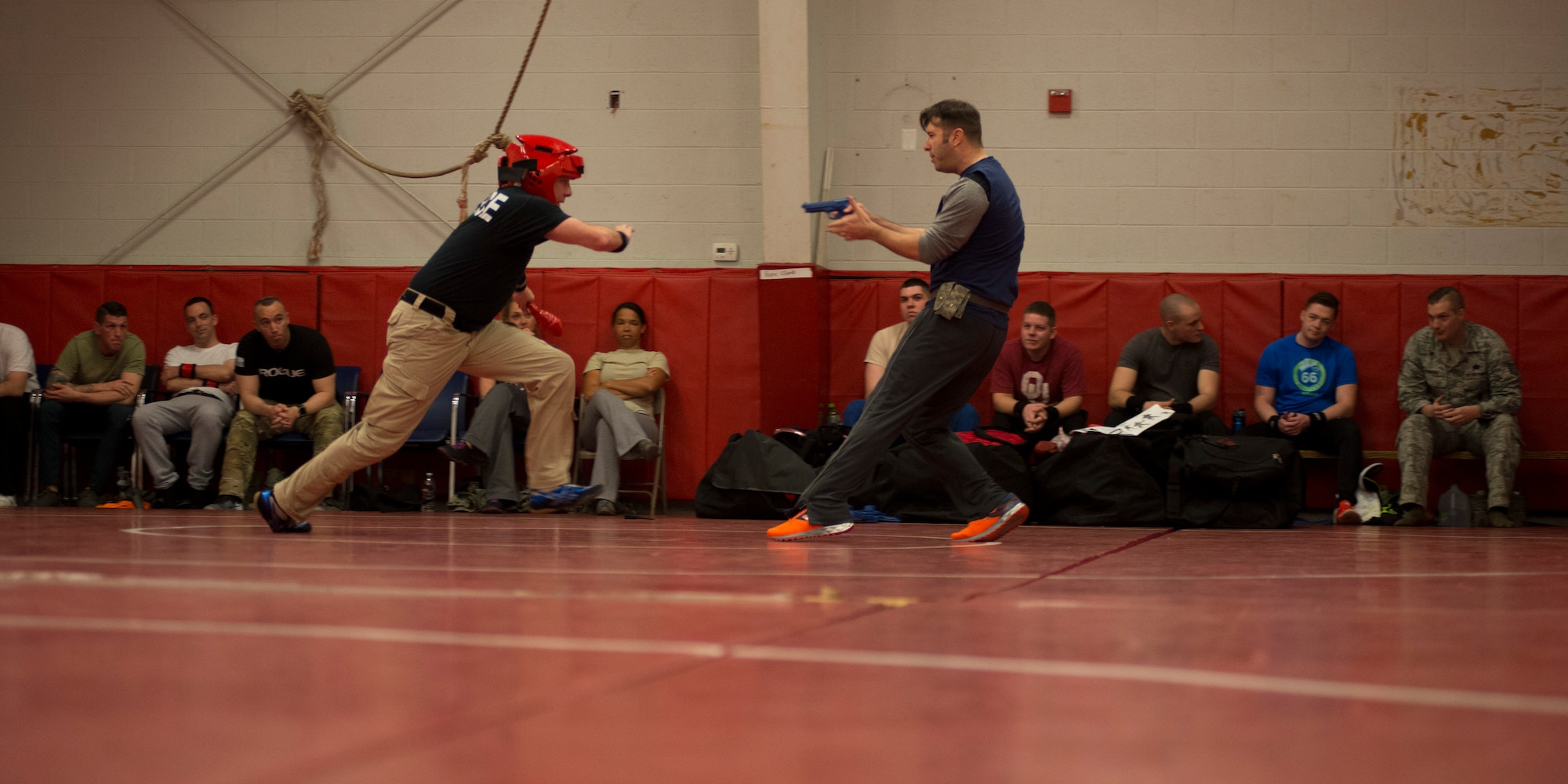 Master Sgt. Craig Yates and Staff Sgt. Justin Talbert, members of the 138th Security Forces Squadron, execute their combative skills during annual training on Feb. 12, 2017 in Collinsville, OK.  Following the training, Talbert discussed the techniques they learned and provided feedback to the airmen on their performance during the training scenarios. (U.S. Air Force photo by Senior Airman Rebecca Imwalle)