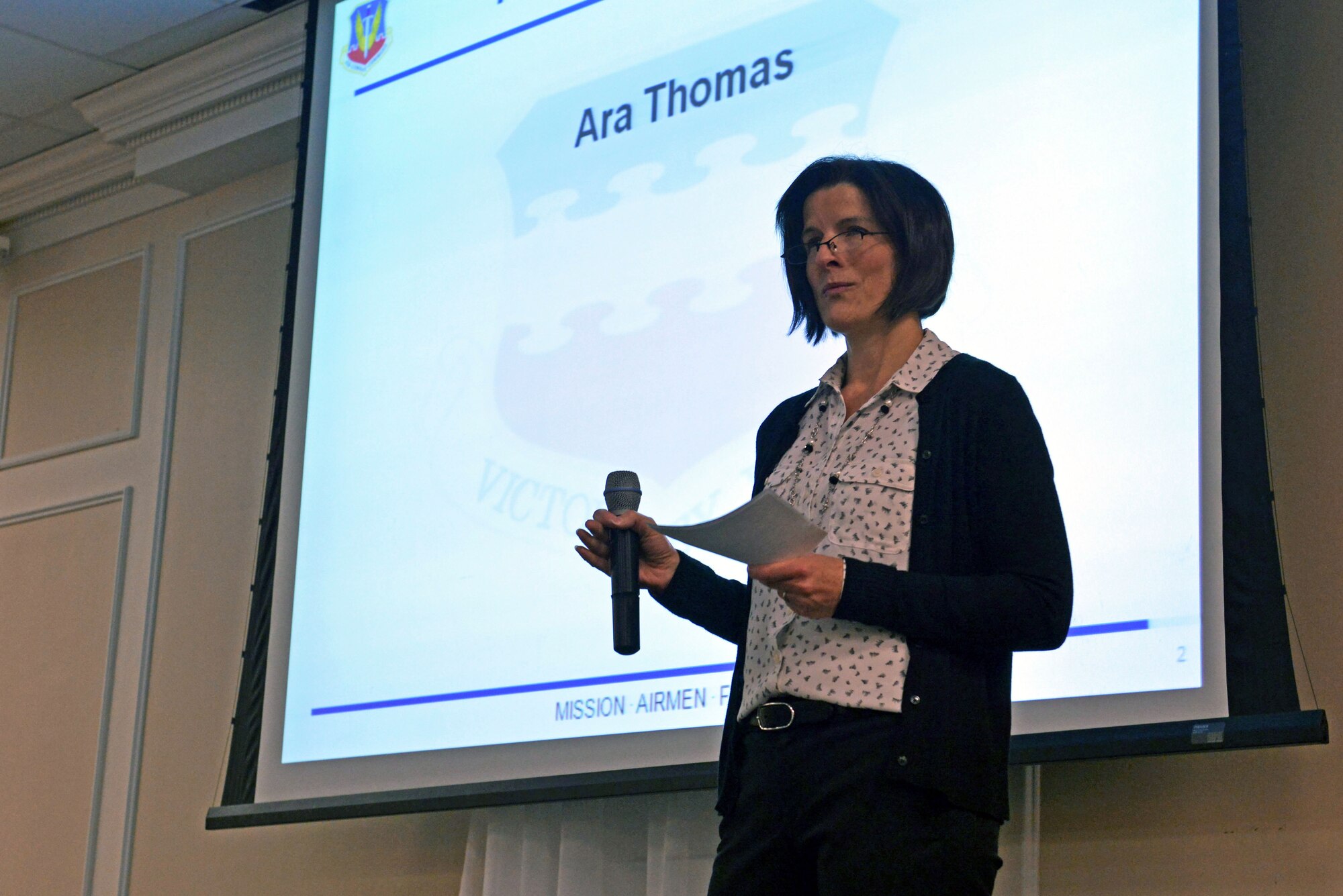 Ara Thomas, 20th Force Support Squadron Airman and Family Readiness Center Key Spouse Program coordinator, briefs families during a pre-deployment dinner at the Carolina Skies and Conference Center at Shaw Air Force Base, S.C., March 13, 2017. Key spouses aim to make contact with families prior to deployments to establish familiarity so Team Shaw members feel comfortable asking them for help. (U.S. Air Force photo by Airman 1st Class Destinee Sweeney)