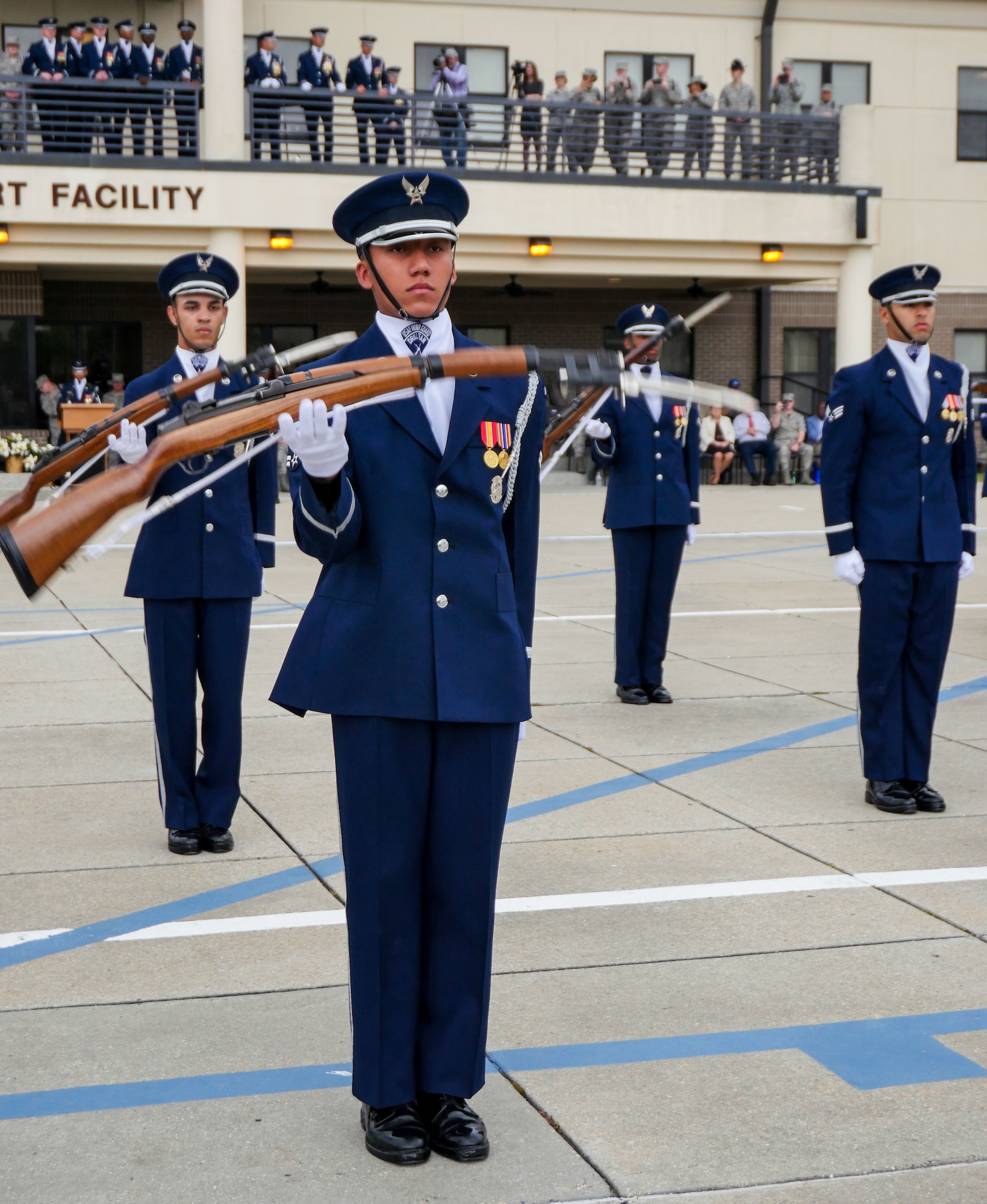 The U.S. Air Force Honor Guard Drill Team debuts their 2017 routine during the 81st Training Group drill down at the Levitow Training Support Facility drill pad March 10, 2017, on Keesler Air Force Base, Miss. The team comes to Keesler every year for five weeks to develop a new routine that they will use throughout the year. (U.S. Air Force photo by Capt. David J. Murphy)