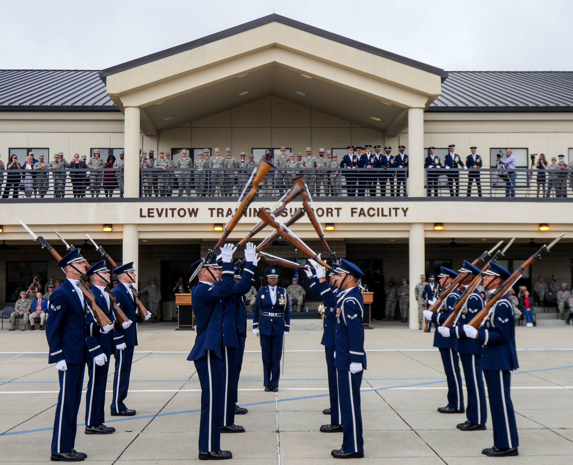 The U.S. Air Force Honor Guard Drill Team debuts their 2017 routine during the 81st Training Group drill down at the Levitow Training Support Facility drill pad March 10, 2017, on Keesler Air Force Base, Miss. The team comes to Keesler every year for five weeks to develop a new routine that they will use throughout the year. (U.S. Air Force photo by Capt. David J. Murphy)