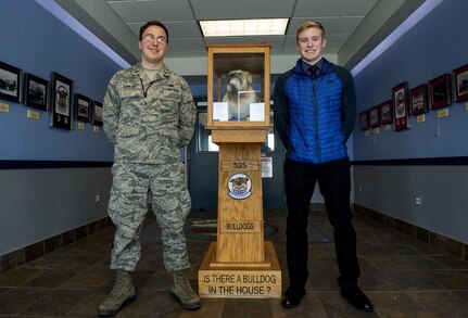 William Bryce Carpenter, University of Anchorage Alaska ROTC cadet, and Air Force 1st Lt. Jonathan Quinlan, assistant officer in charge of the 525th Aircraft Maintenance Unit, stand in the entrance of the 525th AMU's hangar on Joint Base Elmendorf-Richardson, Alaska, March 1, 2017. Carpenter shadowed Quinlan to get a better understanding of what a maintenance officer does.