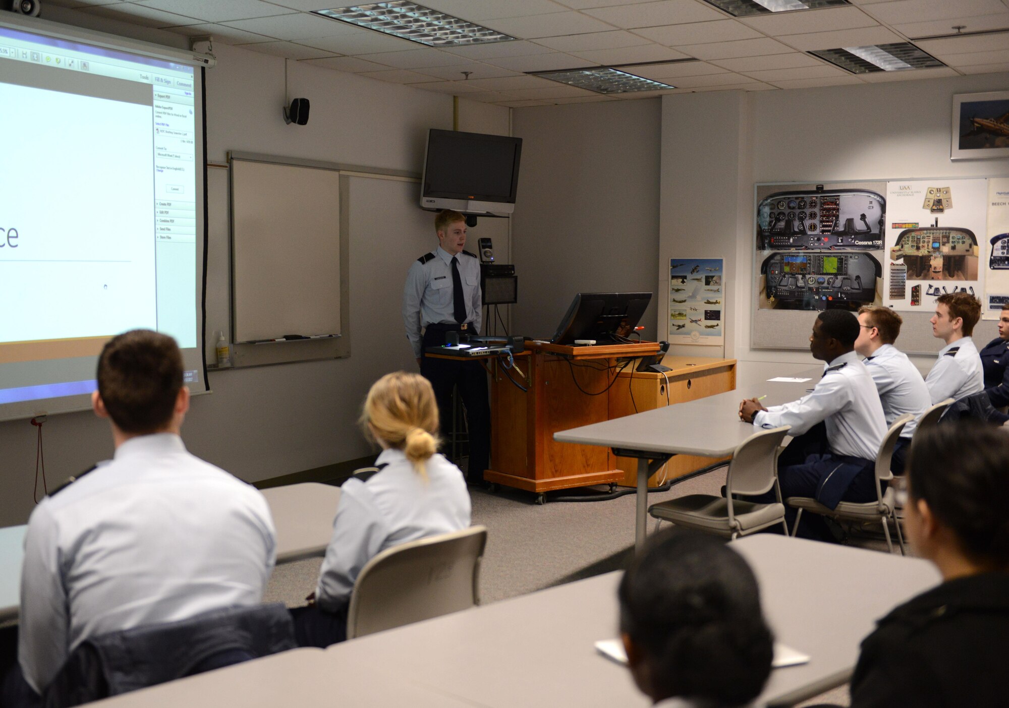 William Bryce Carpenter, University of Anchorage Alaska ROTC cadet, briefs his classmates on his experience shadowing Air Force 1st Lt. Jonathan Quinlan, assistant officer in charge of the 525th Aircraft Maintenance Unit, in Anchorage, March 10, 2017. The UAA ROTC cadets shadowed different Joint Base Elmendorf-Richardson officers to get a better understanding of what that officer's job is. 
