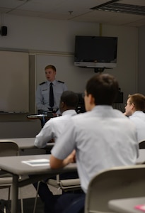 William Bryce Carpenter, University of Anchorage Alaska ROTC cadet, briefs his classmates on his experience shadowing Air Force 1st Lt. Jonathan Quinlan, assistant officer in charge of the 525th Aircraft Maintenance Unit, in Anchorage, March 10, 2017. The UAA ROTC cadets shadowed different Joint Base Elmendorf-Richardson officers to get a better understanding of what that officer's job is. 