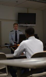 William Bryce Carpenter, University of Anchorage Alaska ROTC cadet, briefs his classmates on his experience shadowing Air Force 1st Lt. Jonathan Quinlan, assistant officer in charge of the 525th Aircraft Maintenance Unit, in Anchorage, March 10, 2017. The UAA ROTC cadets shadowed different Joint Base Elmendorf-Richardson officers to get a better understanding of what that officer's job is. 