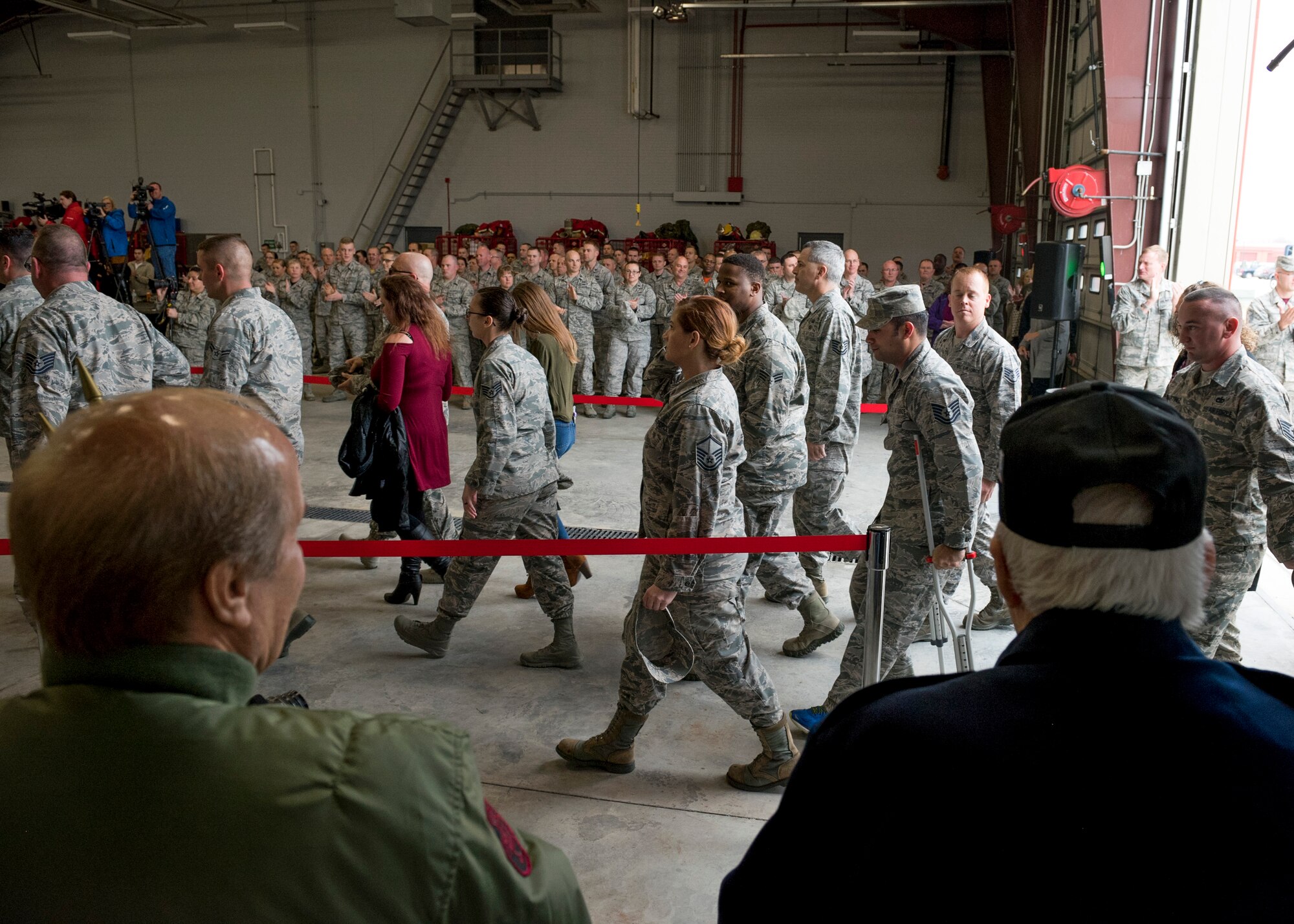 Fellow Airmen, family and supporters welcome home over 91 Airmen from deployment during a ceremony at the 138th Fighter Wing in Tulsa, Okla., March 5, 2017. The ceremony was held to welcome the Airmen home and recognize their efforts and contributions made overseas while deployed. (U.S. Air National Guard photo by Senior Airman Rebecca Imwalle)