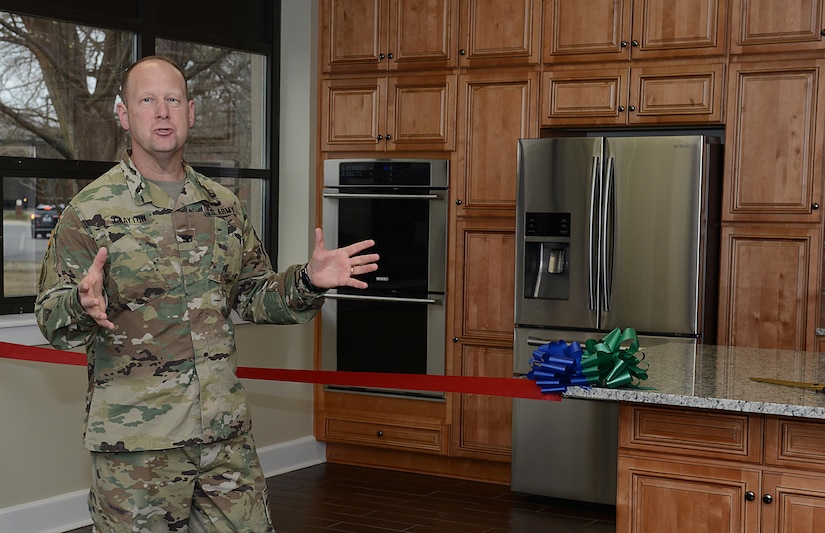 U.S. Army Col. Ralph Clayton III, 733rd Mission Support Group commander, welcomes guests to the Army Community Service Emergency Family Assistance Center’s teaching kitchen ribbon cutting ceremony at Joint Base Langley-Eustis, Va., March 13, 2017. The ACS will host classes, such as Cooking on a Budget, in the new kitchen, which is open to all JBLE community members. (U.S. Air Force photo/Staff Sgt. Teresa J. Cleveland)