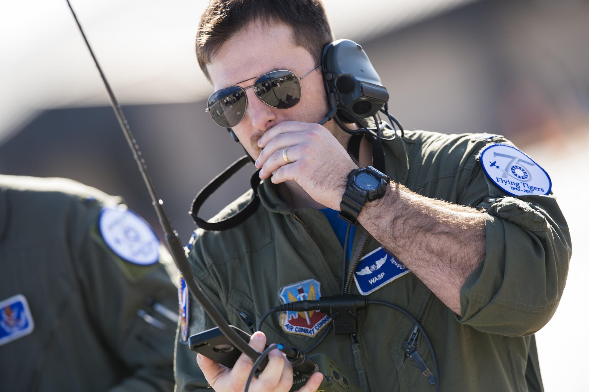 Capt. Andrew Nemethy, 74th Fighter Squadron A-10C Thunderbolt II pilot, coordinates a combat search and rescue demonstration during the 75th Anniversary Flying Tiger Reunion, March 10, 2017, at Moody Air Force Base, Ga. In 1941, President Roosevelt signed an executive order forming the American Volunteer Group. The AVG was organized into the 1st, 2nd, and 3rd Pursuit Squadrons and later disbanded and replaced by the 23d Fighter Group in 1942. Under the command of Gen. Claire Chennault, the Flying Tigers comprised of the 74th, 75th, and 76th Pursuit Squadrons defended China against the Japanese. Throughout World War II, the Flying Tigers achieved combat success and flew the US-made Curtiss P-40 Warhawks painted with the shark-mouth design. (U.S. Air Force photo by Senior Airman Ceaira Young)